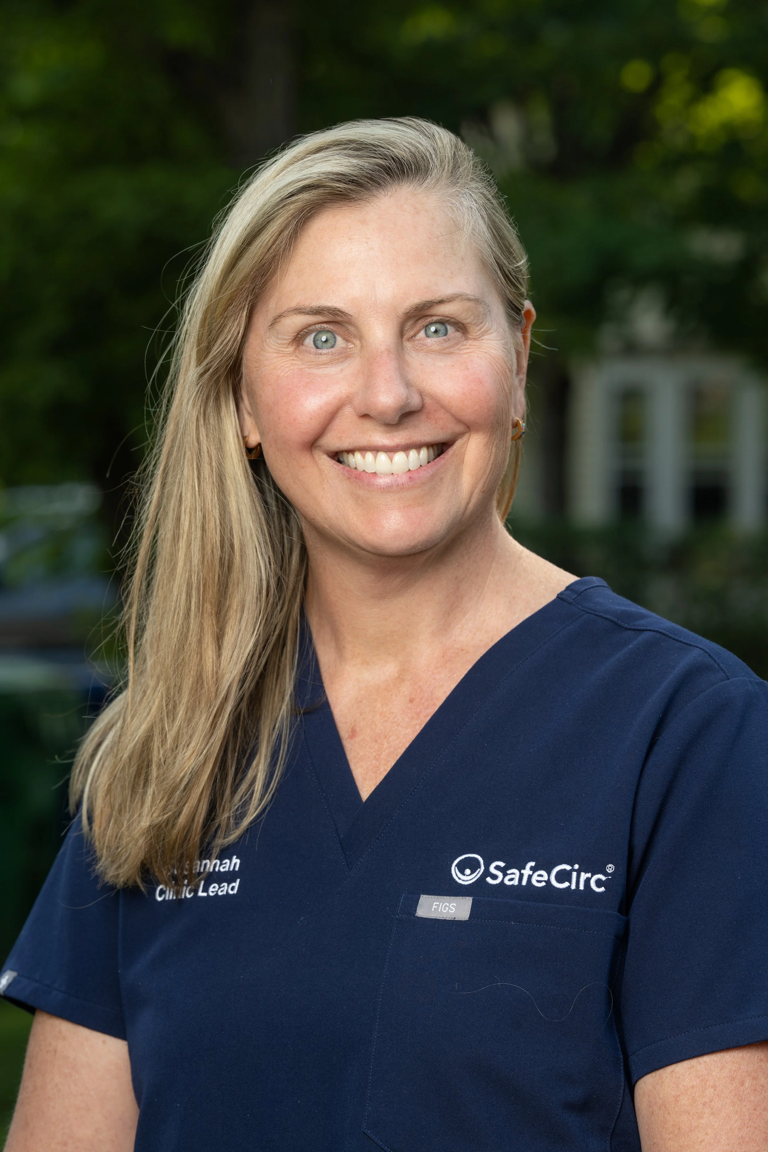 Headshot of Susannah Blair wearing a navy blue medical scrub top with SafeCirc logo