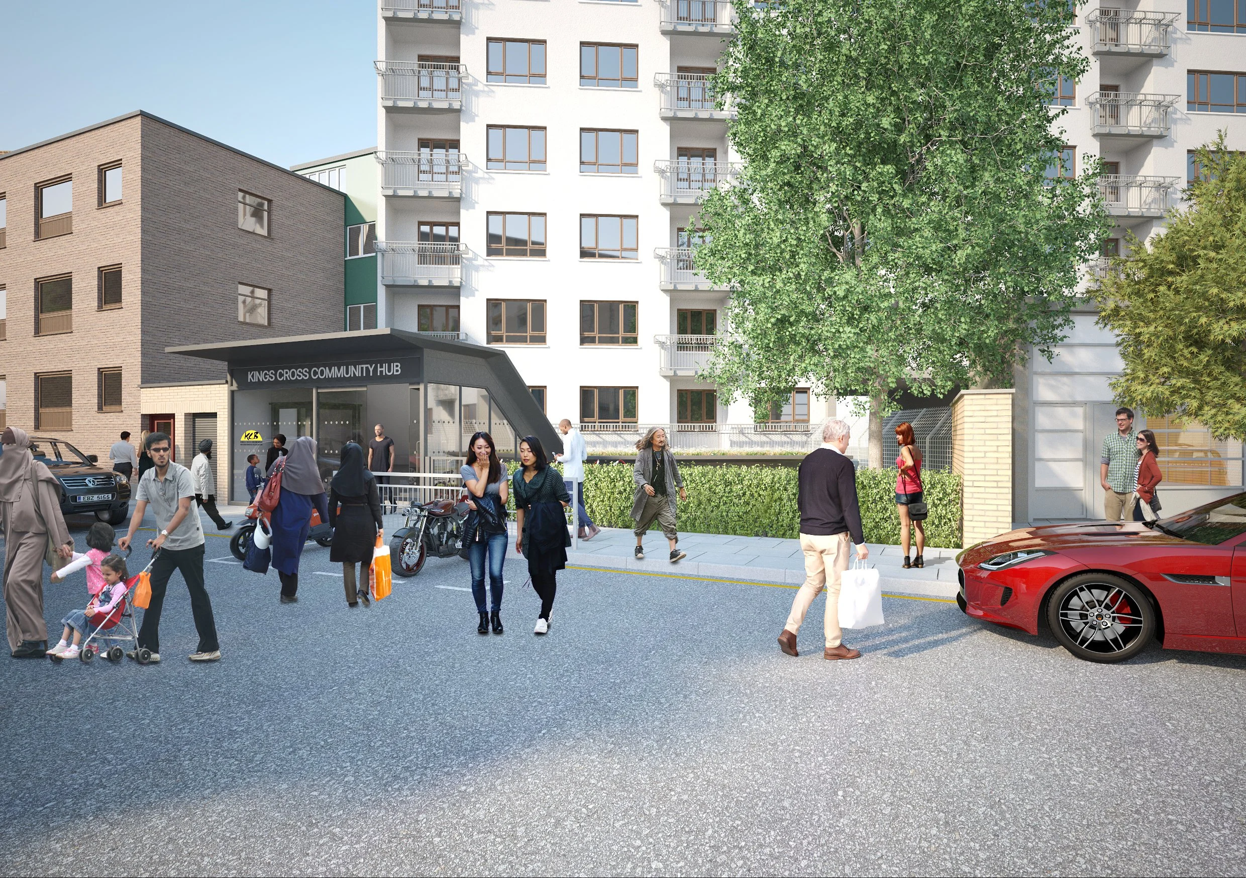 Street view of a modern front glass extension of the community centre with white and brick facade, a small outdoor seating area with table and chairs. Kings Cross Community HUB