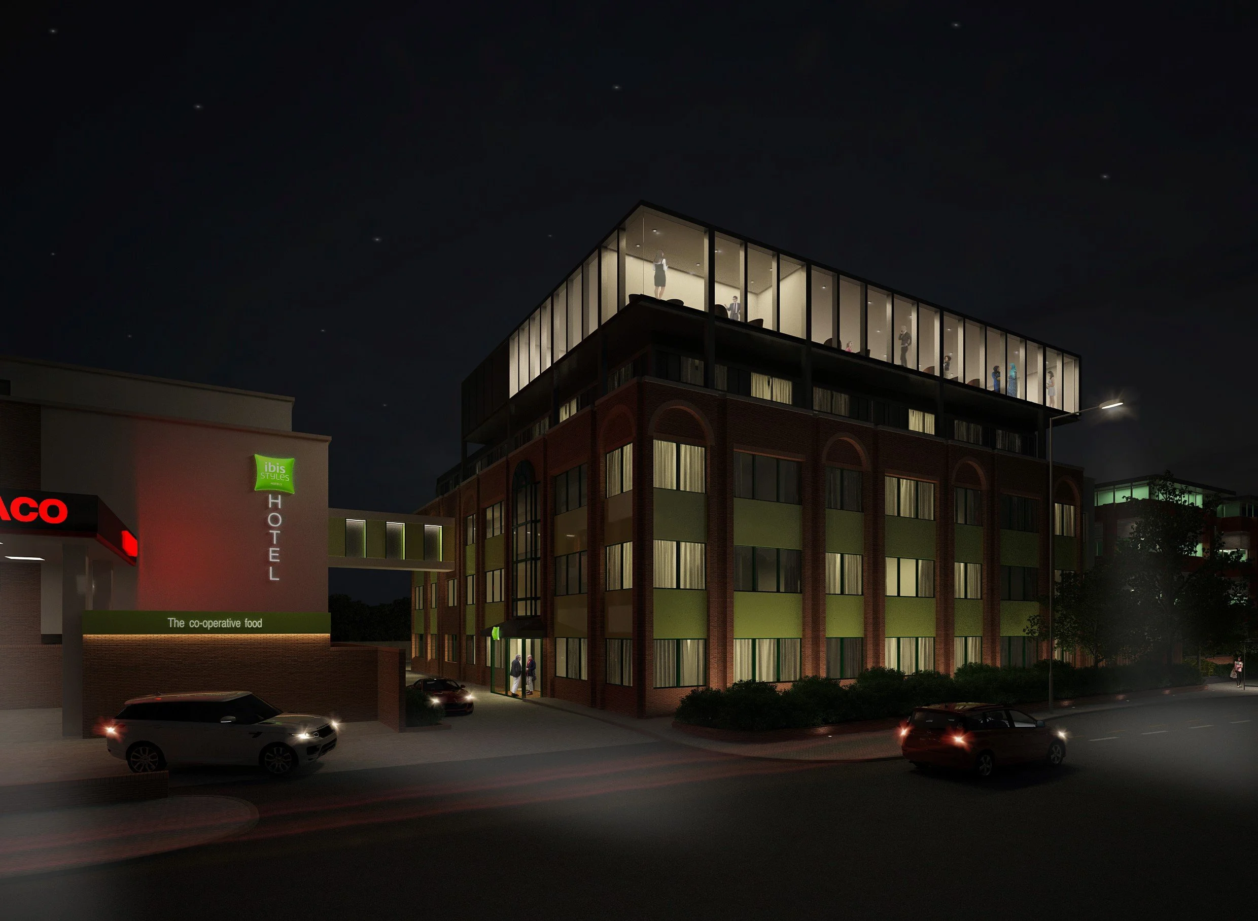 Night-time view of a modern roof extension with large glass windows,  of the Ibis Style Hotel Bath Road