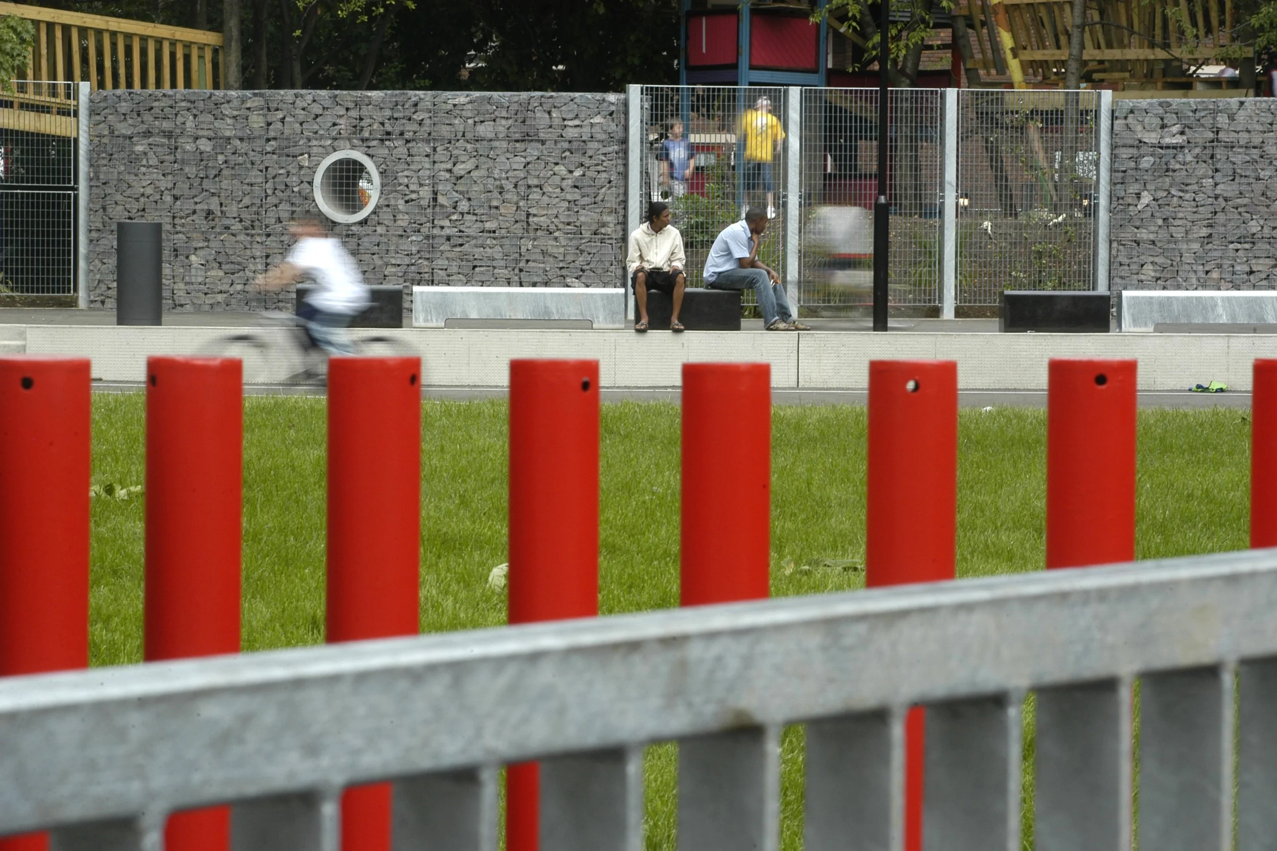 Purpose design red anti scooter gate and sport pitch with seating around in Bingfield Park