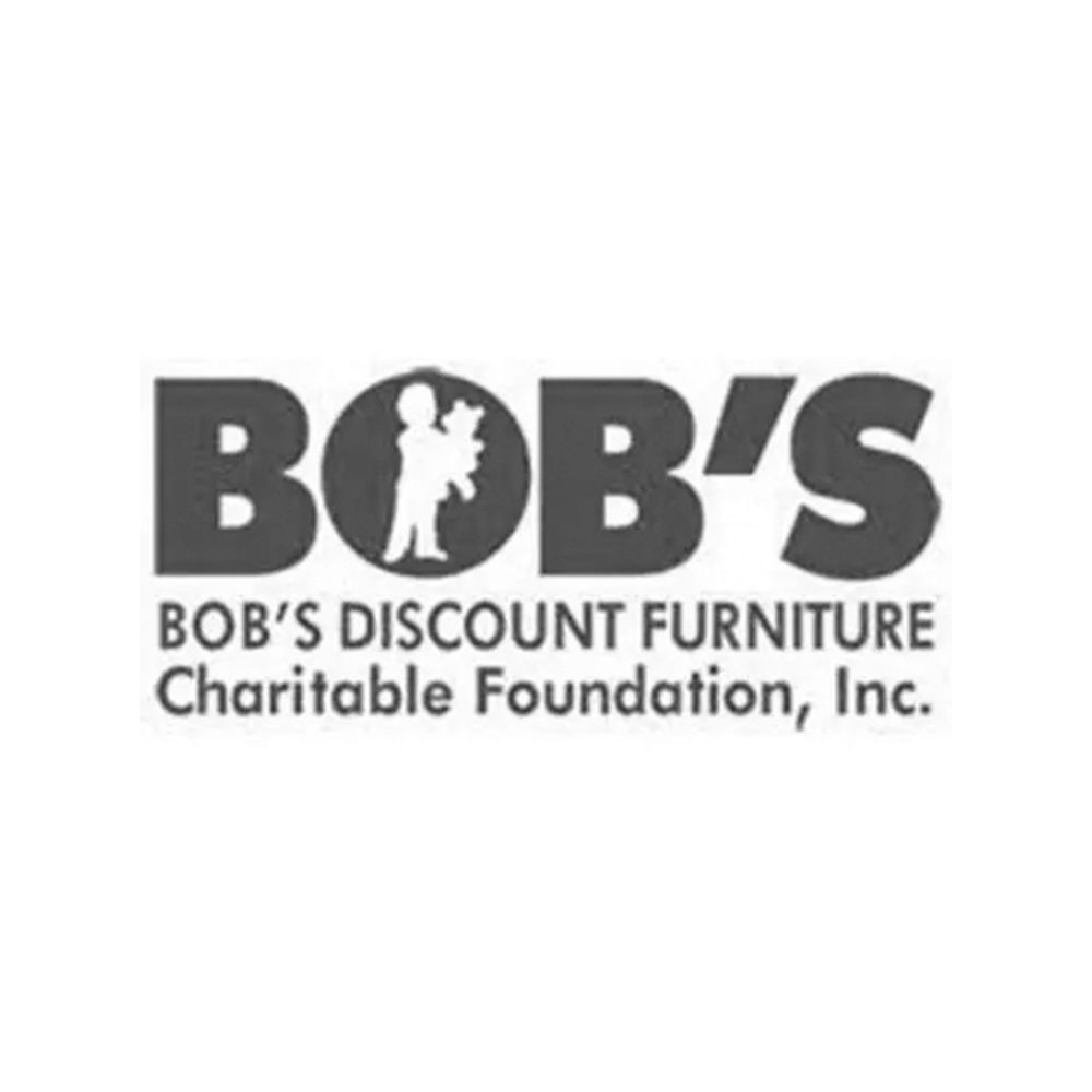 Logo for Bob's Discount Furniture Charitable Foundation, Inc. featuring the silhouette of a person carrying a box.