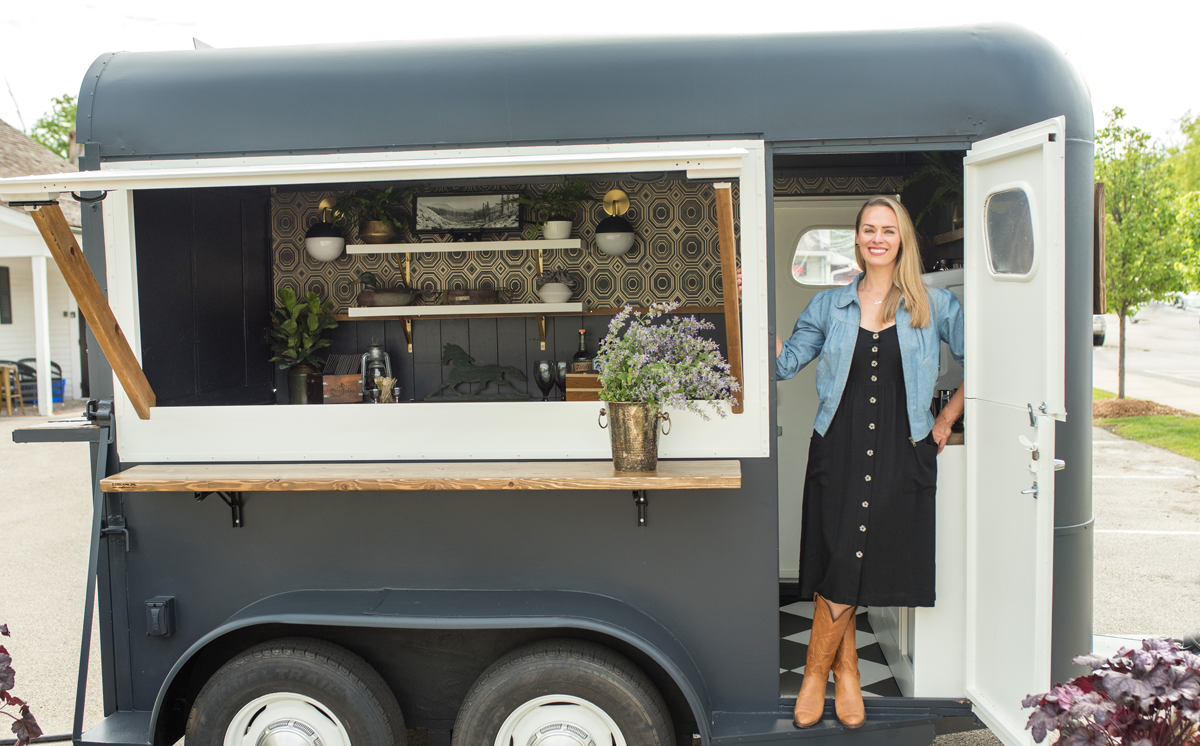 Emily showcases the bar and cocktail horse trailer