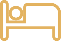 A simple line drawing of a bed with a pillow.