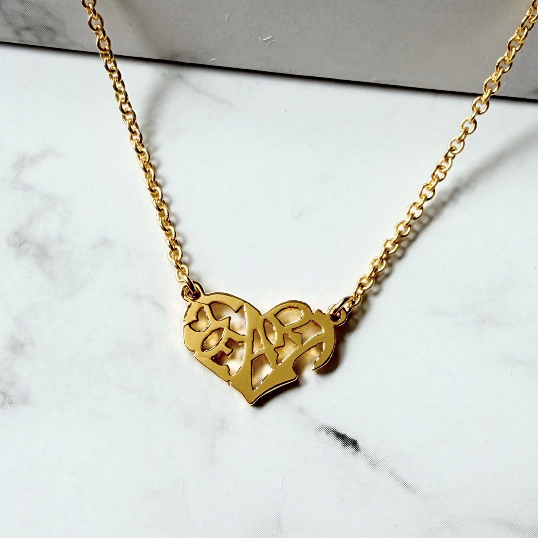 Heart in English symmetry petit necklace.jpg