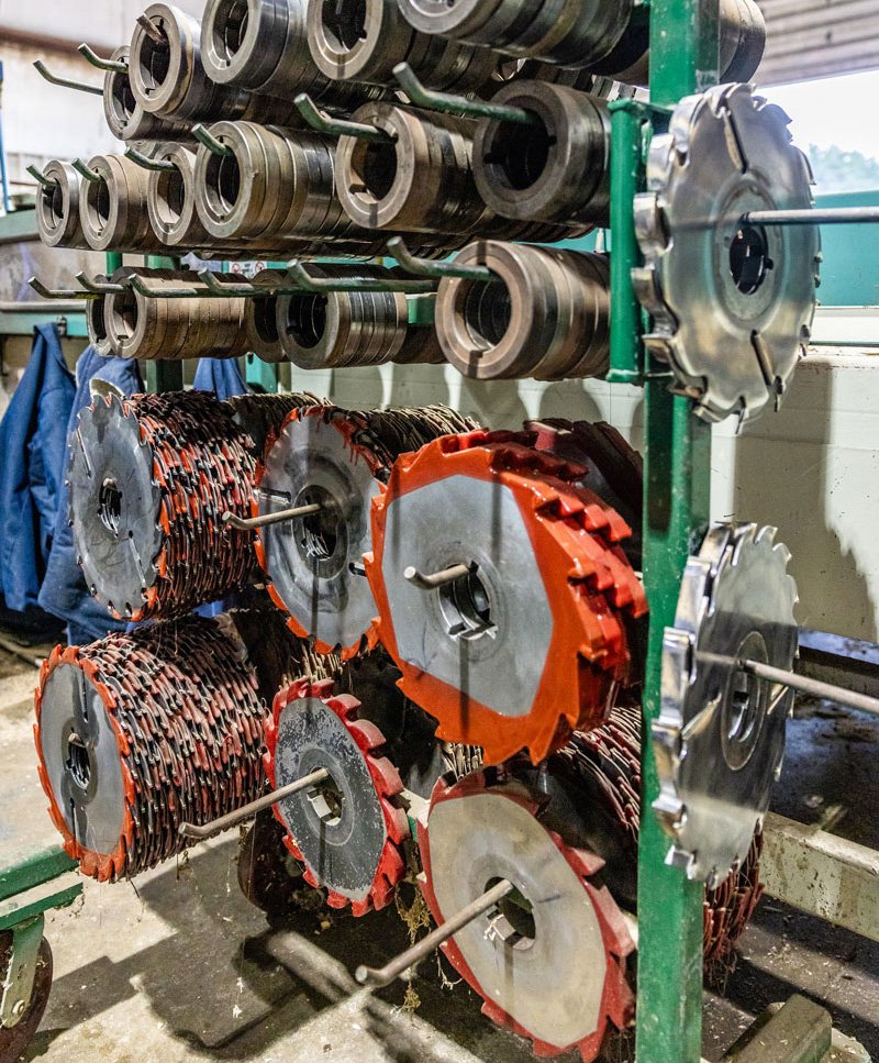 circular saw blades hanging on a rack ready for wood cutting