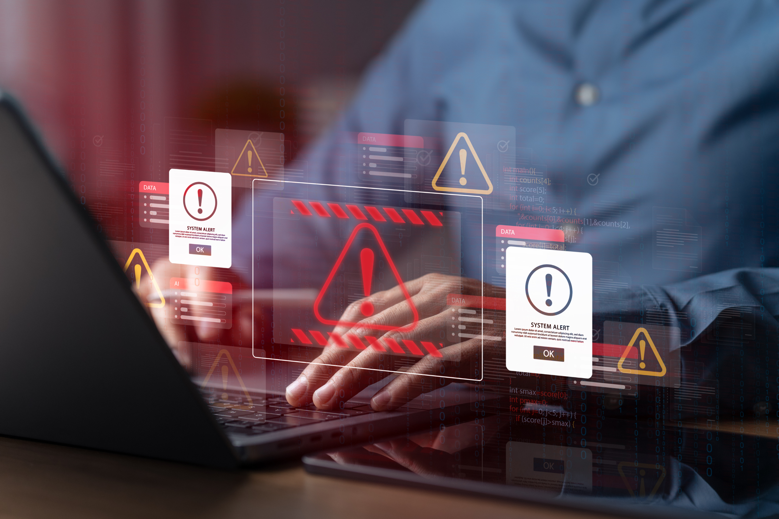 Person operating a laptop with digital warning alerts and error messages overlaid, indicating system alerts and potential cybersecurity threats.