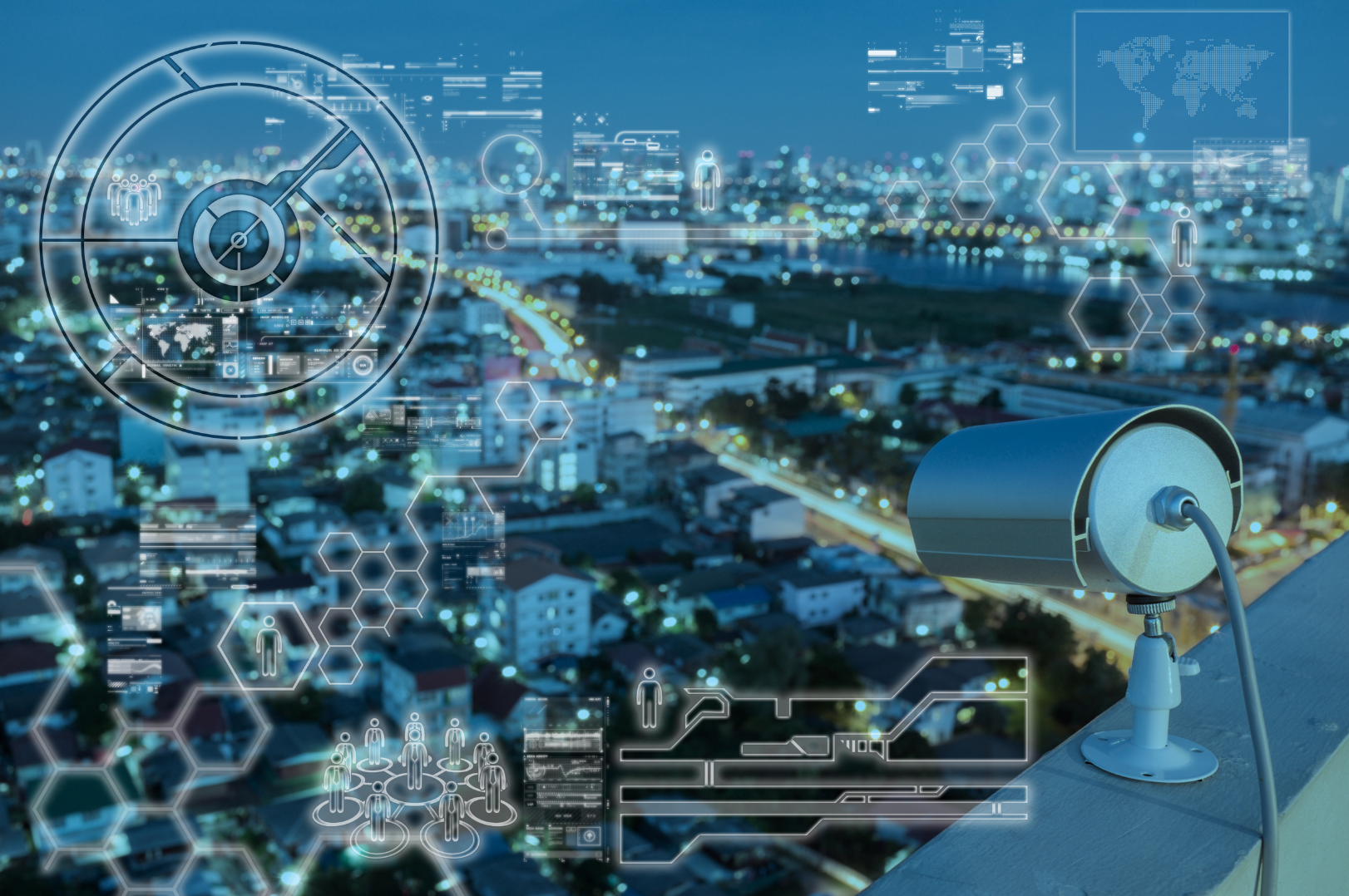 Nighttime view of a cityscape with digital overlay graphics, including data charts, human icons, and hexagonal patterns, and a security camera on a rooftop.