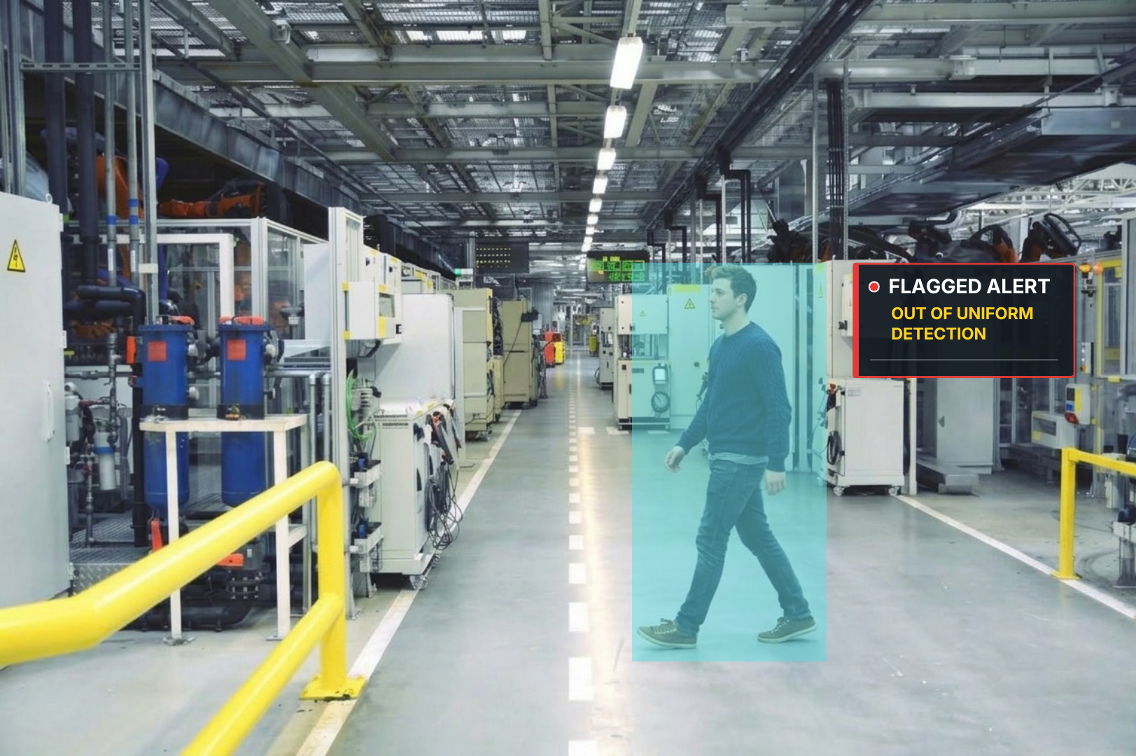 A man walking inside a large industrial or manufacturing facility with machinery and equipment on both sides. A digital alert overlay displays a red circle with a warning icon, and text indicating a flagged alert for 'Out of Uniform Detection' in yellow letters.