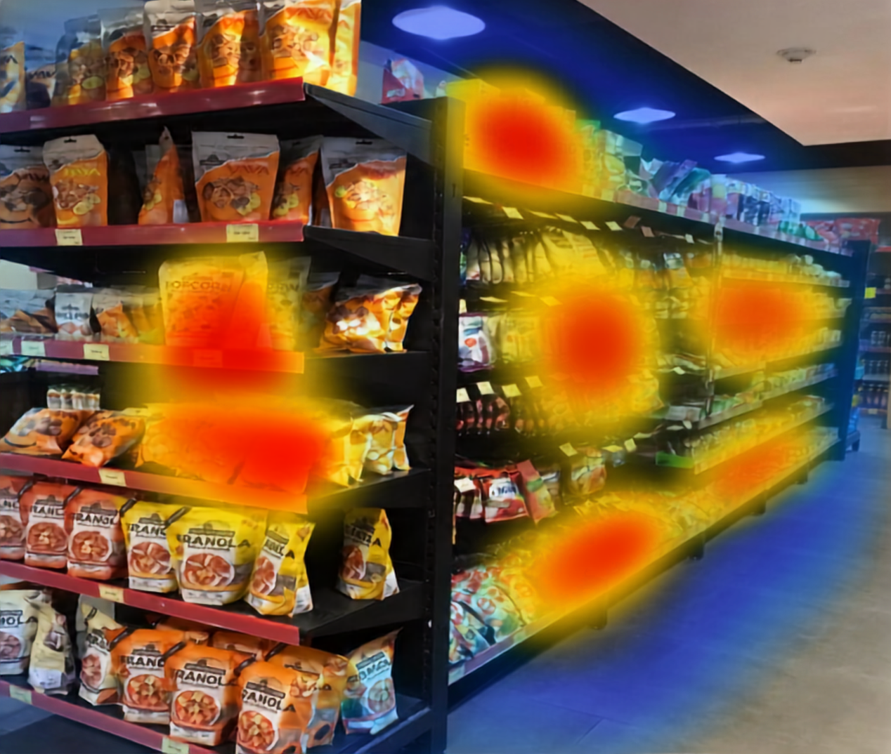 Grocery store aisle with shelves filled with various snack bags, highlighted by heatmap spots indicating areas of interest or focus.