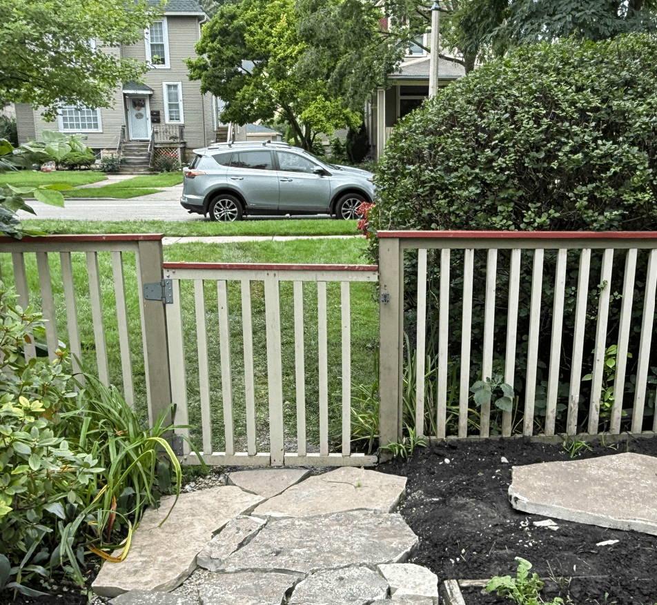 Broken fence in Oak Park with missing paint