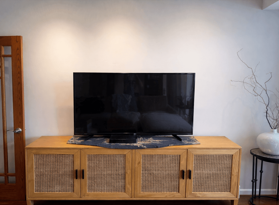 TV on TV stand on entertainment center in Oak Park home