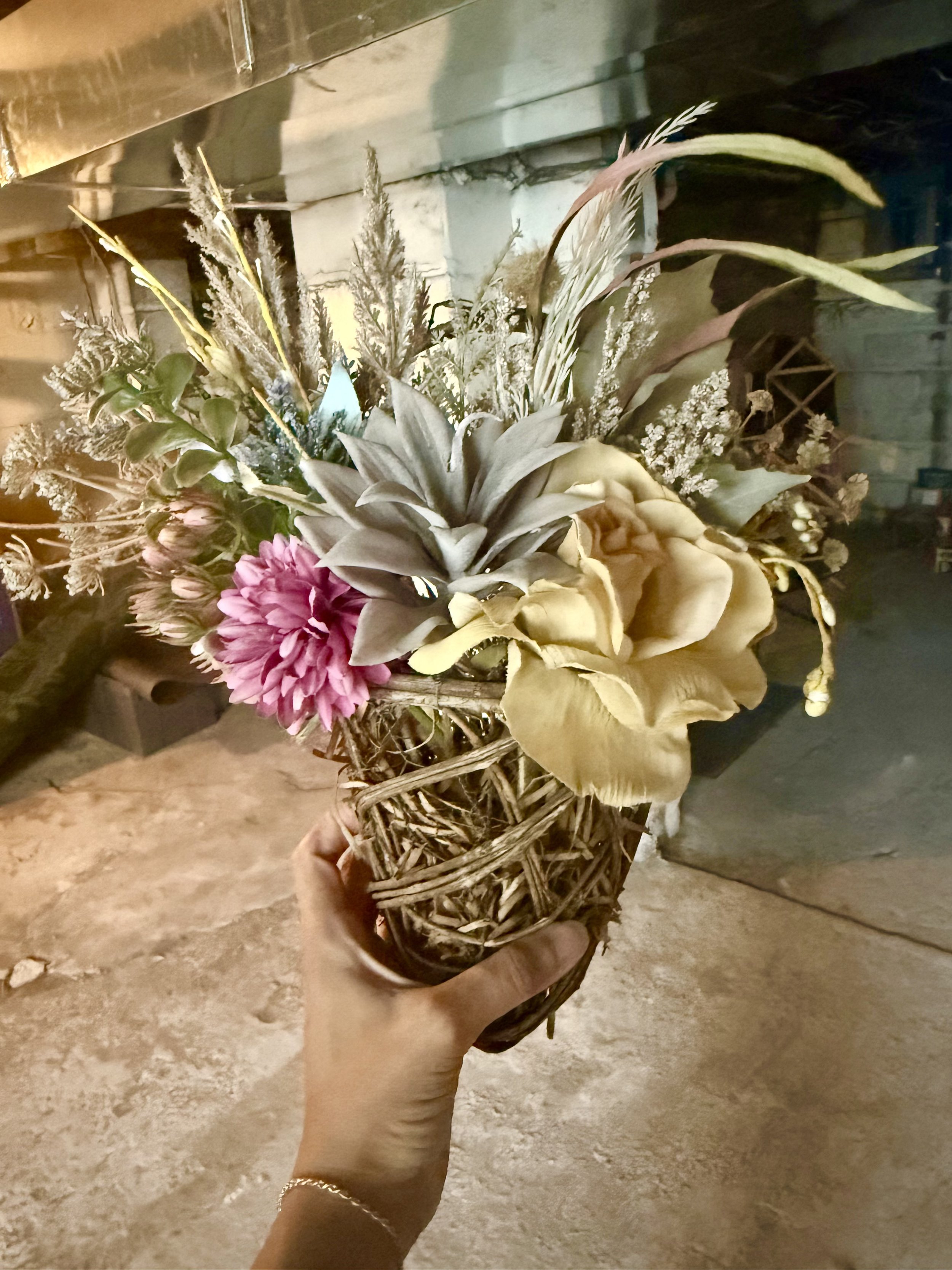 intended to take place of a front door wreath and a pop of pink to match her welcome mat