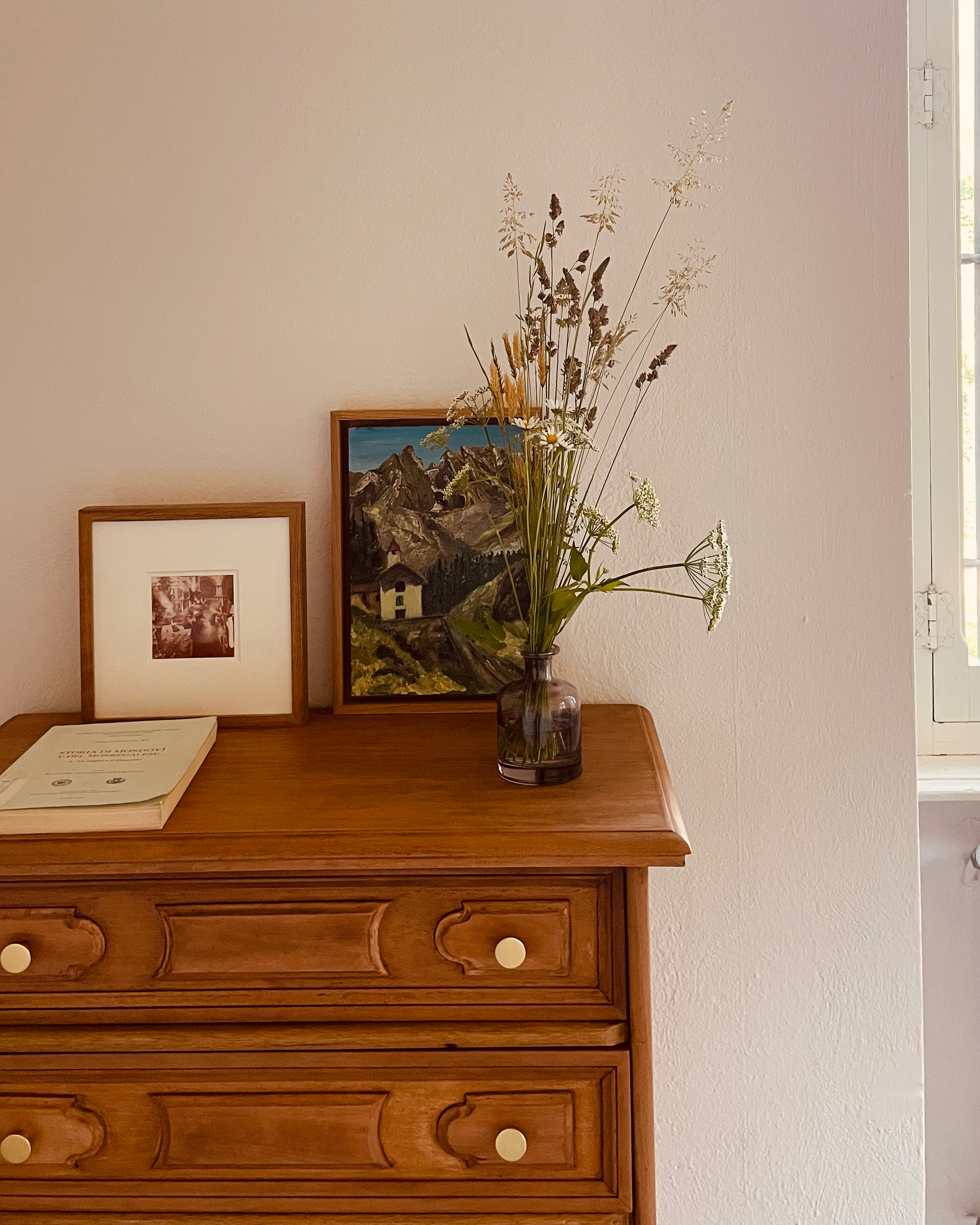 Antique furniture and collected objects inside Villa Oberti, a restored historic villa in Piedmont