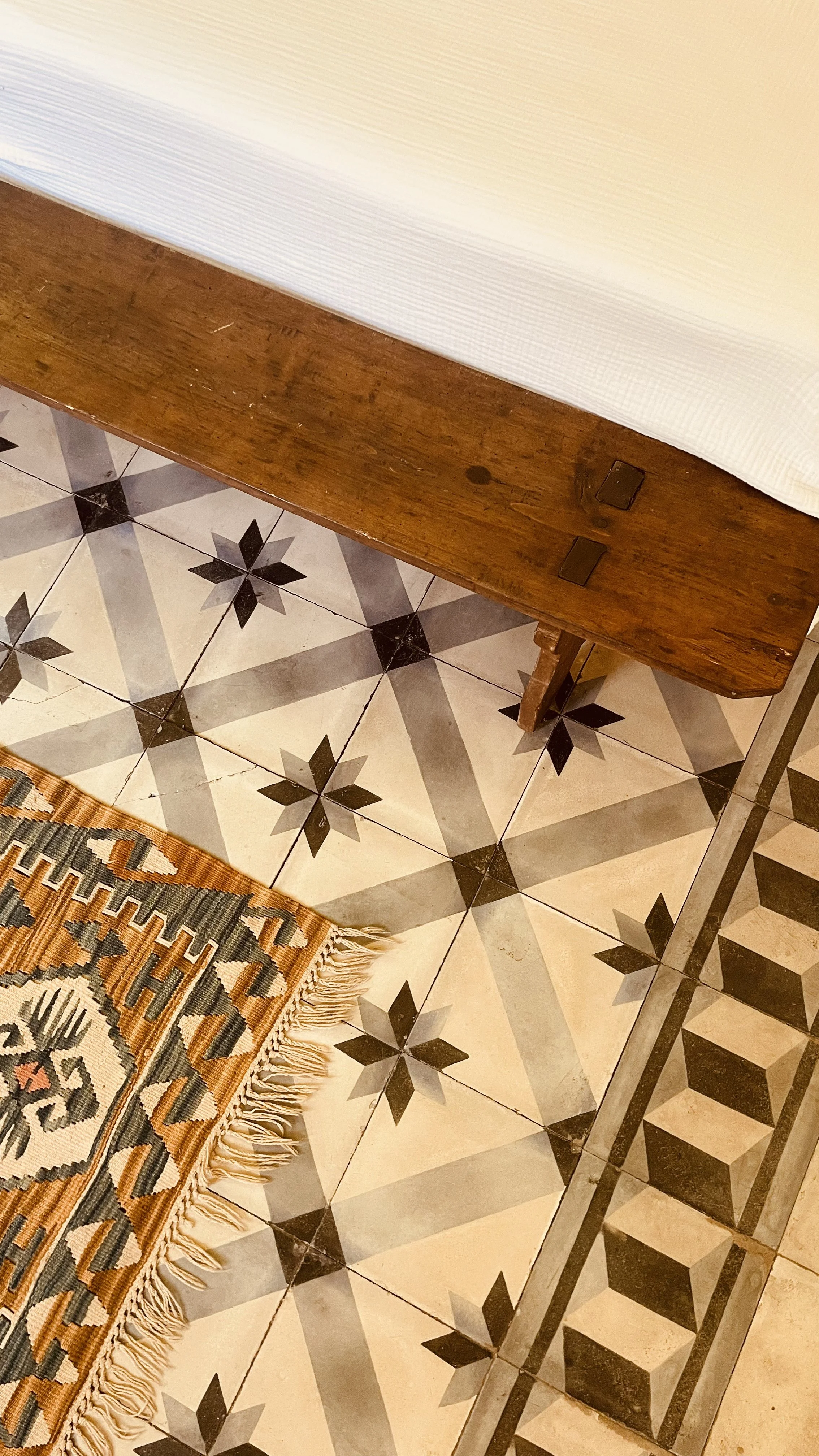Original tiled floors and layered interiors at Villa Oberti, a restored 1912 villa in Piedmont