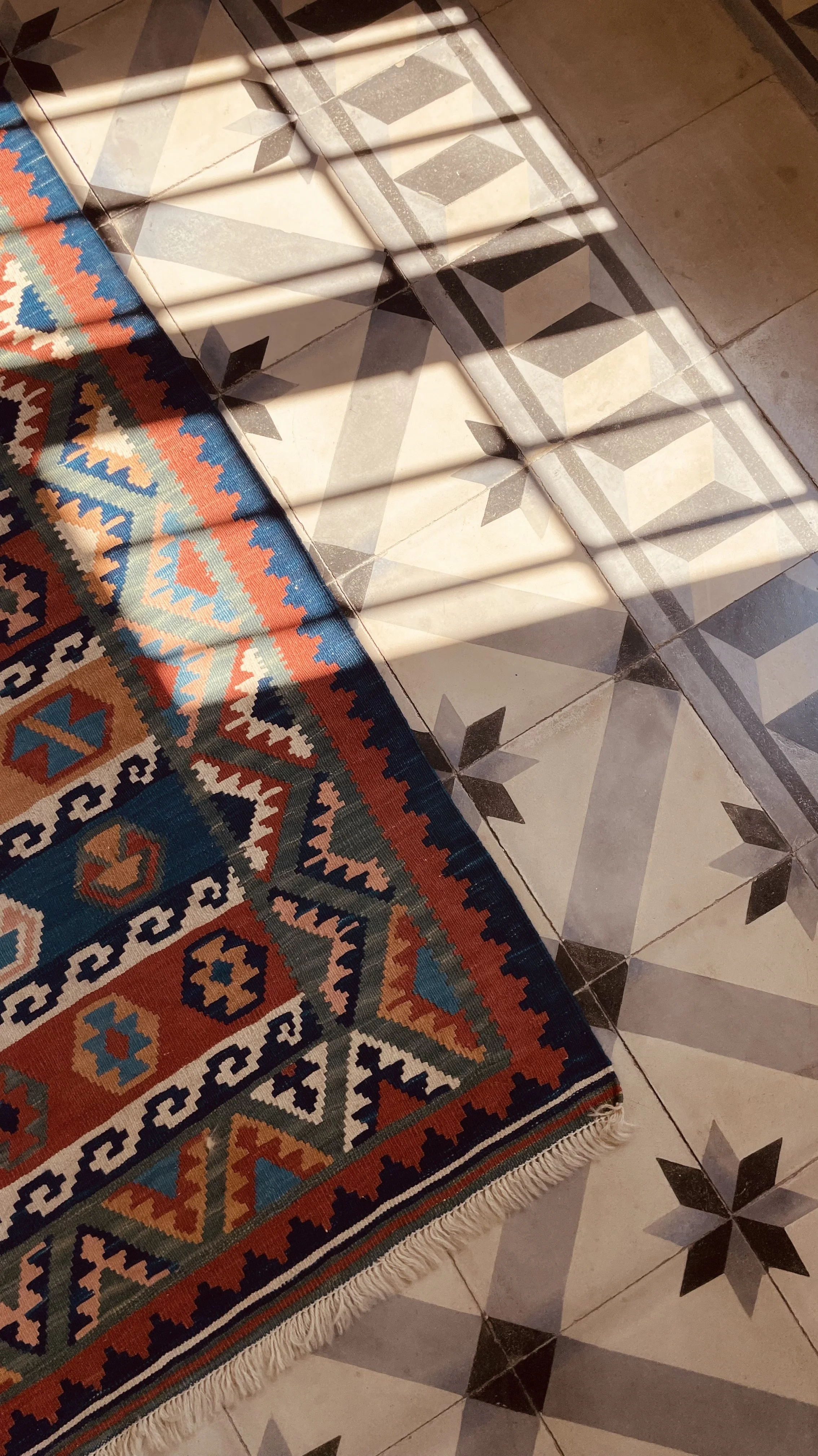 Historic tiled floors and colourful textiles at Villa Oberti, a private villa in Piedmont