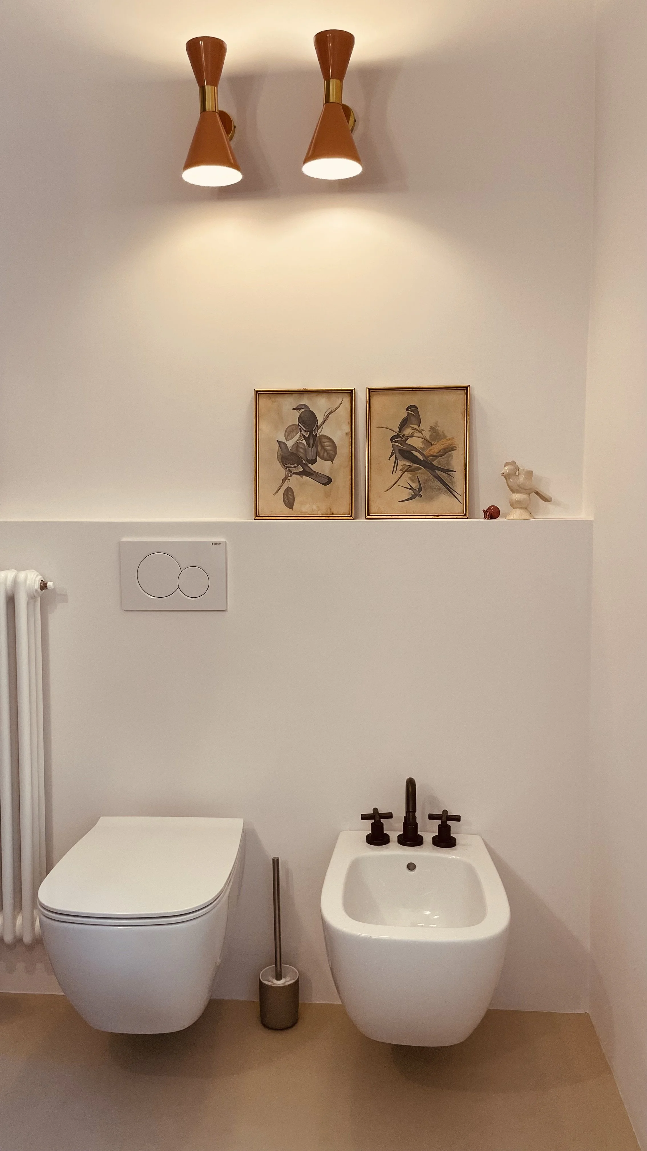 Refined bathroom with vintage bird prints at Villa Oberti, a historic private villa in the Piedmont countryside