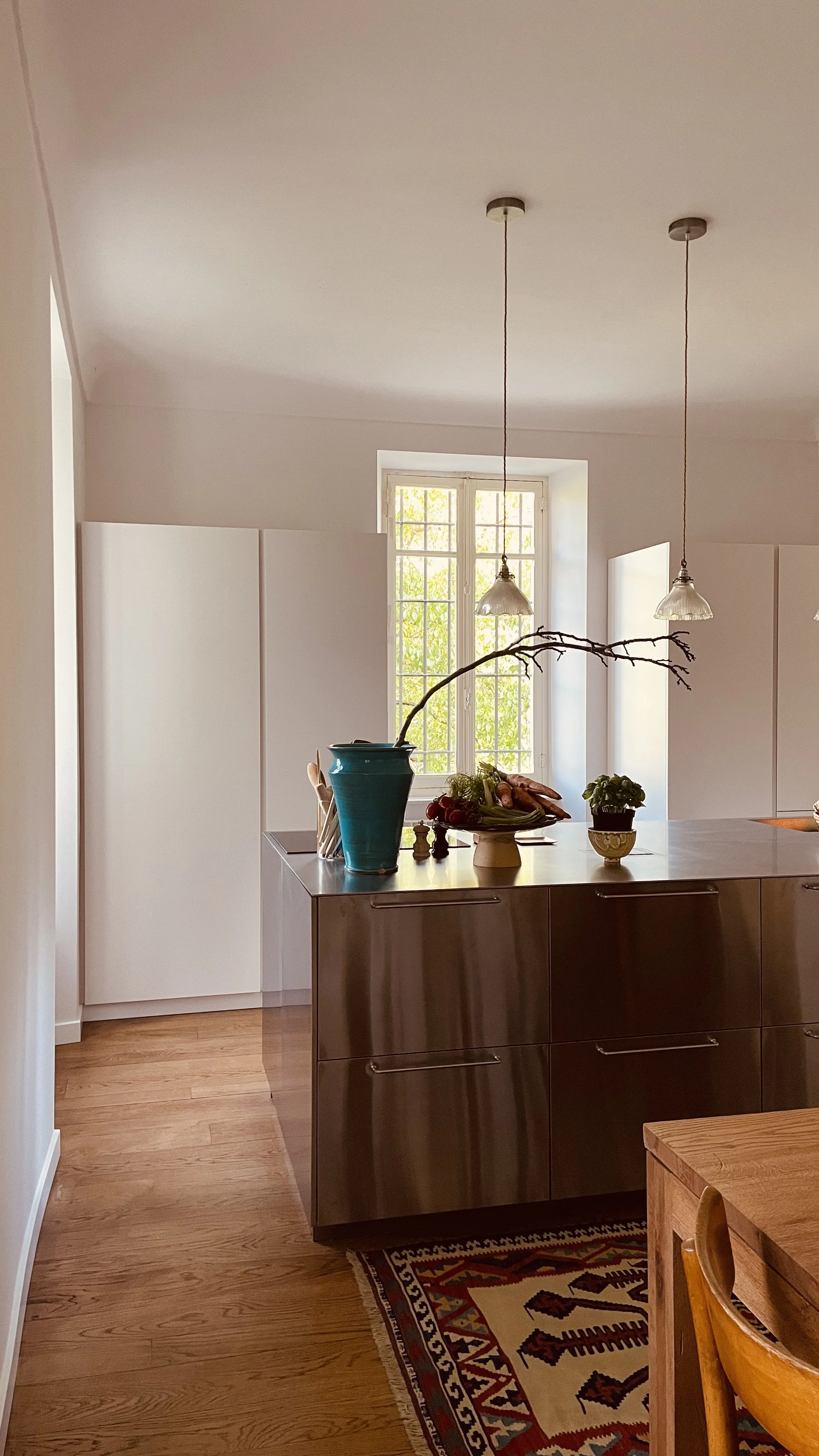 Bright country kitchen at Villa Oberti with garden produce and natural light, in a charming villa near Mondovì and the Langhe