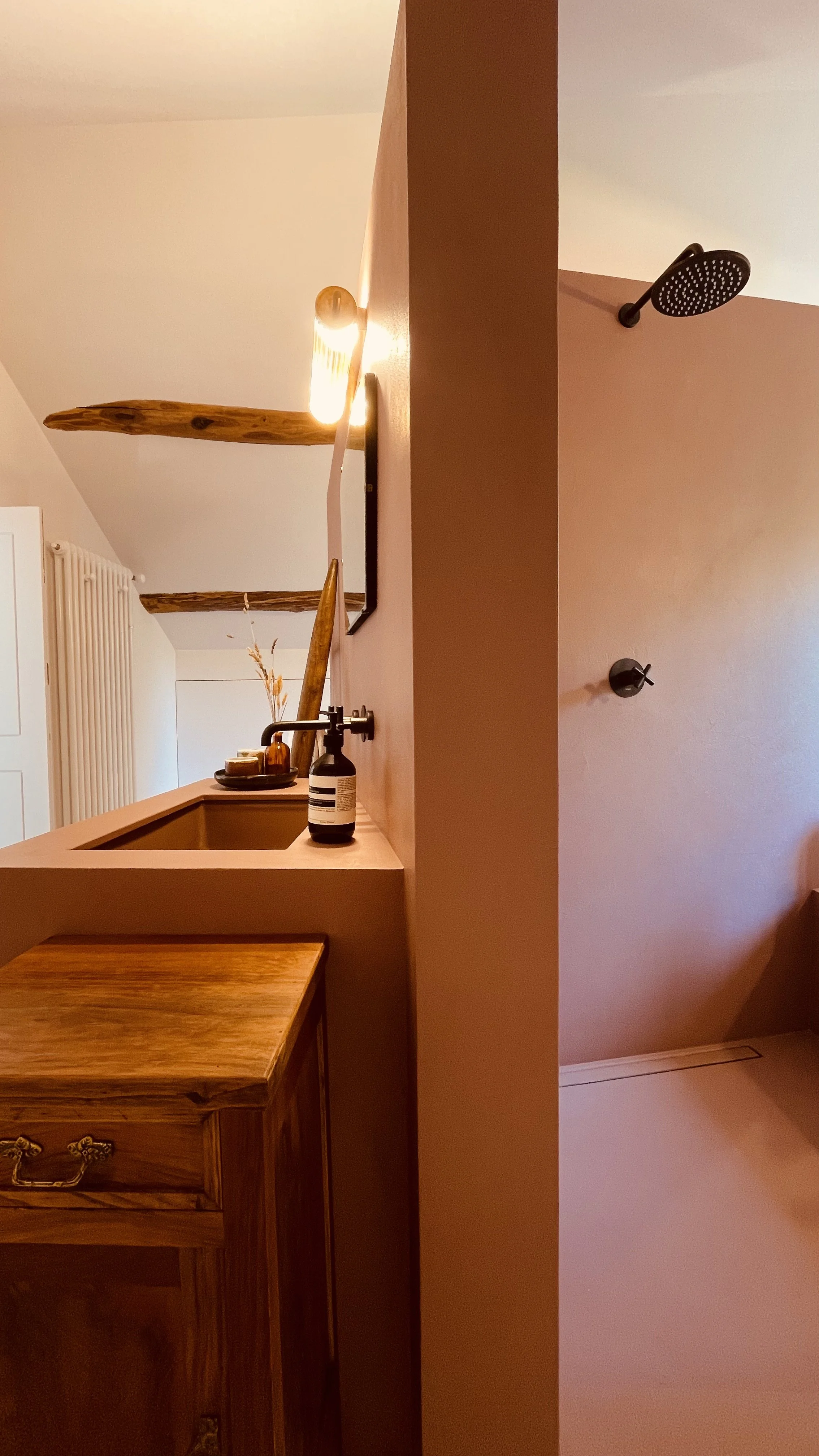 Walk-in shower and sculptural bathroom design at Villa Oberti, a refined private villa near the Langhe in Piedmont