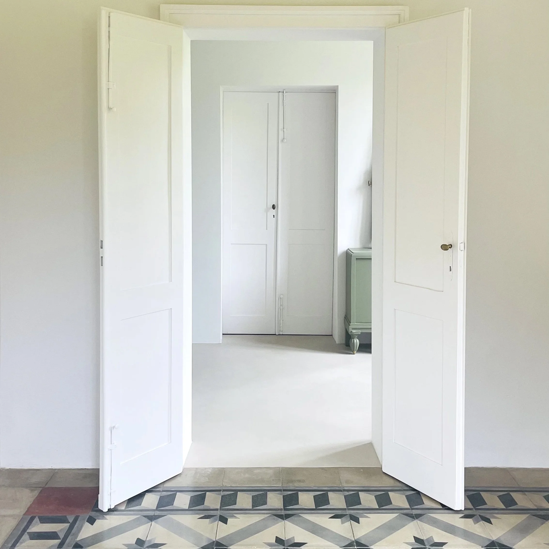 Original tiled floor and bright interior at Villa Oberti, a restored historic villa near Mondovì and the Langhe in Piedmont