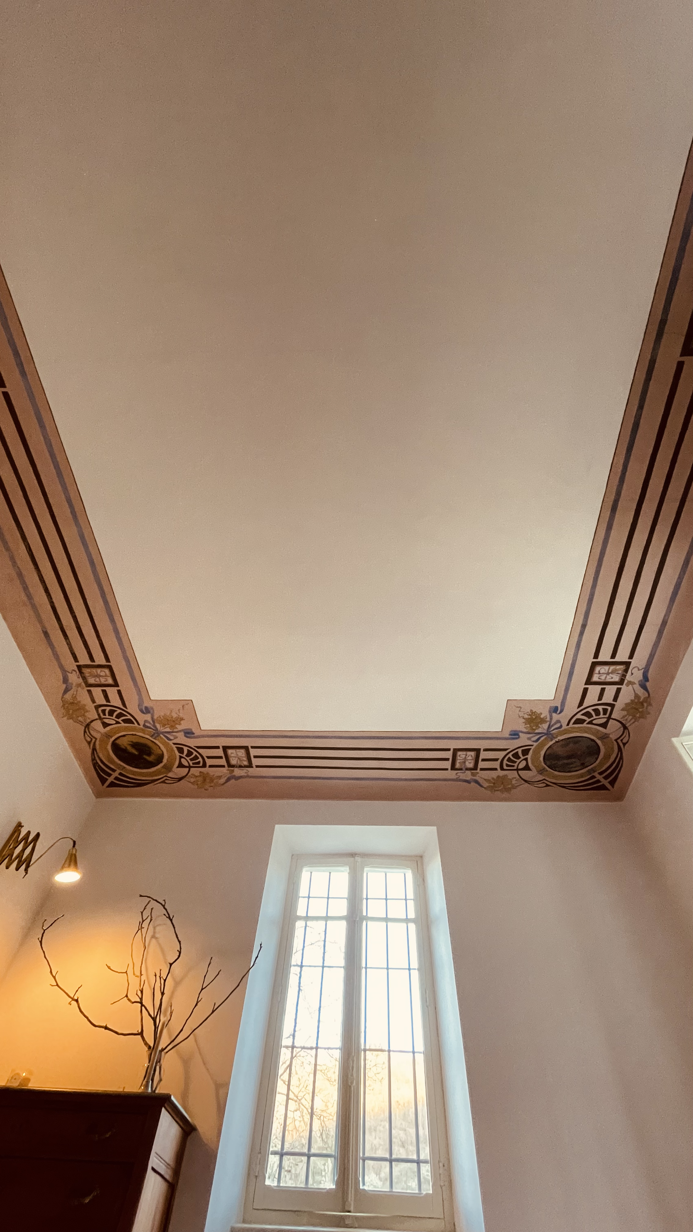 Original restored ceiling frescoes at Villa Oberti, a historic 1912 villa in Piedmont near the Langhe