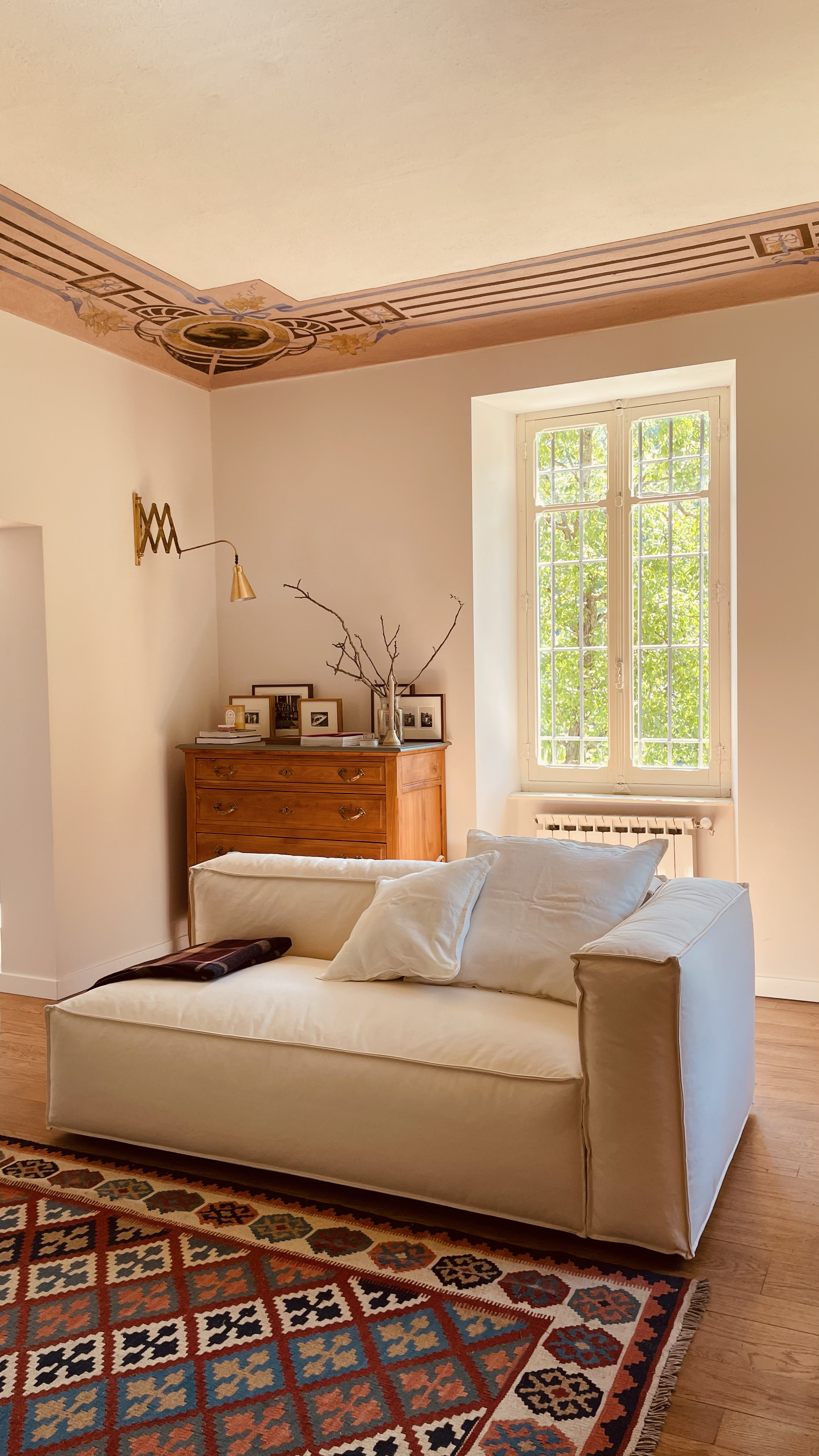 Elegant seating area in the frescoed living room at Villa Oberti, a charming villa near Mondovì in Piedmont