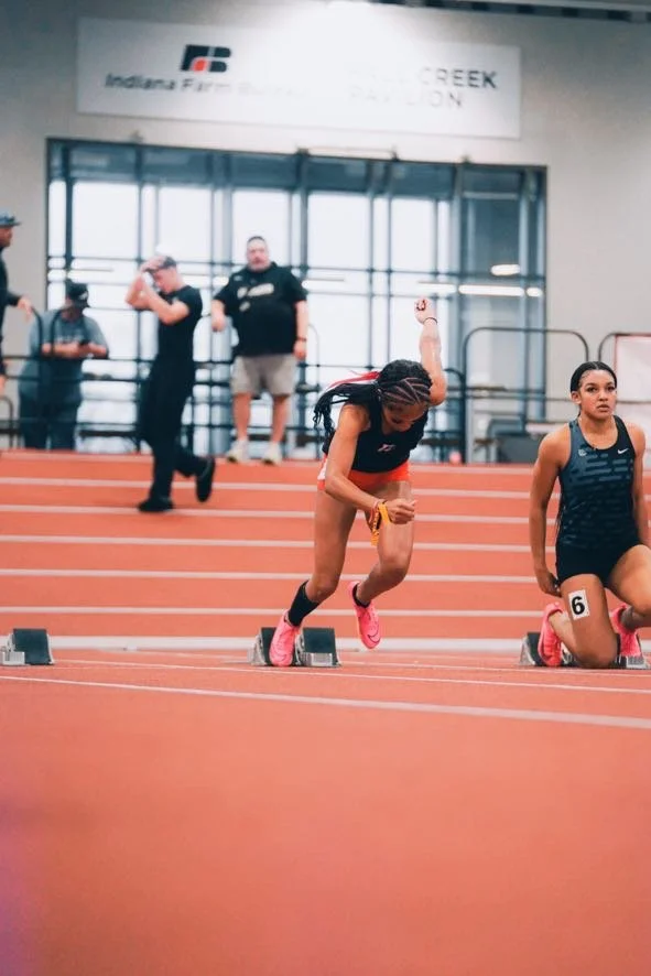 Devyn Day running indoor track and field at the Fall Creek Pavillion