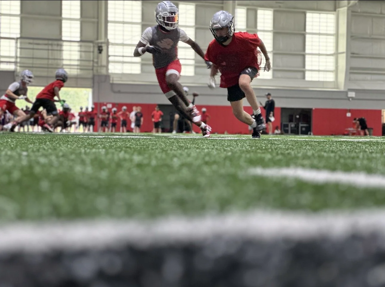football player using speed on the football field and playing 7 on 7 football at ball state university
