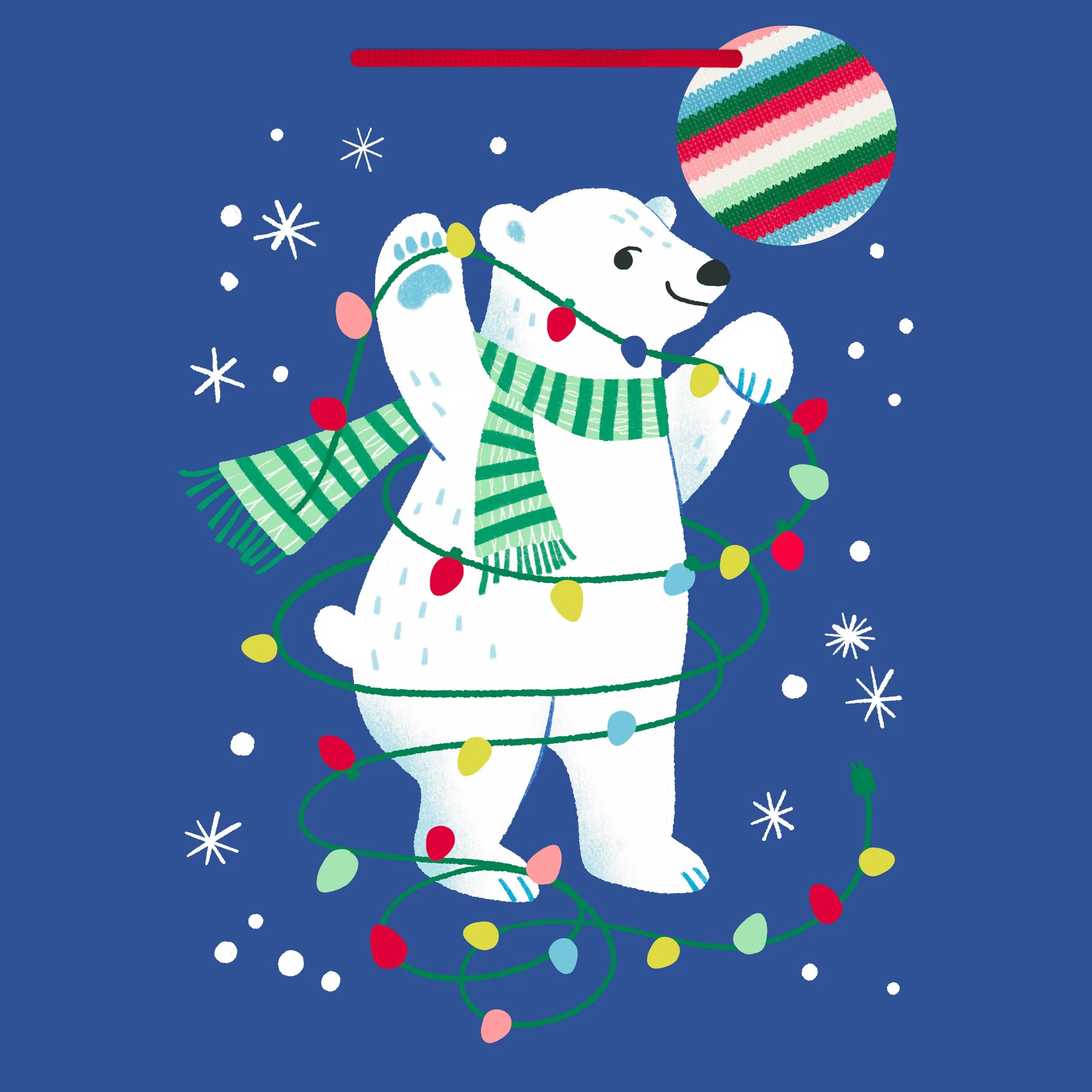 A cartoon polar bear wearing a green striped scarf, holding a string of colorful Christmas lights, with a large decorated ornament hanging above it, set against a blue background with white snowflakes.