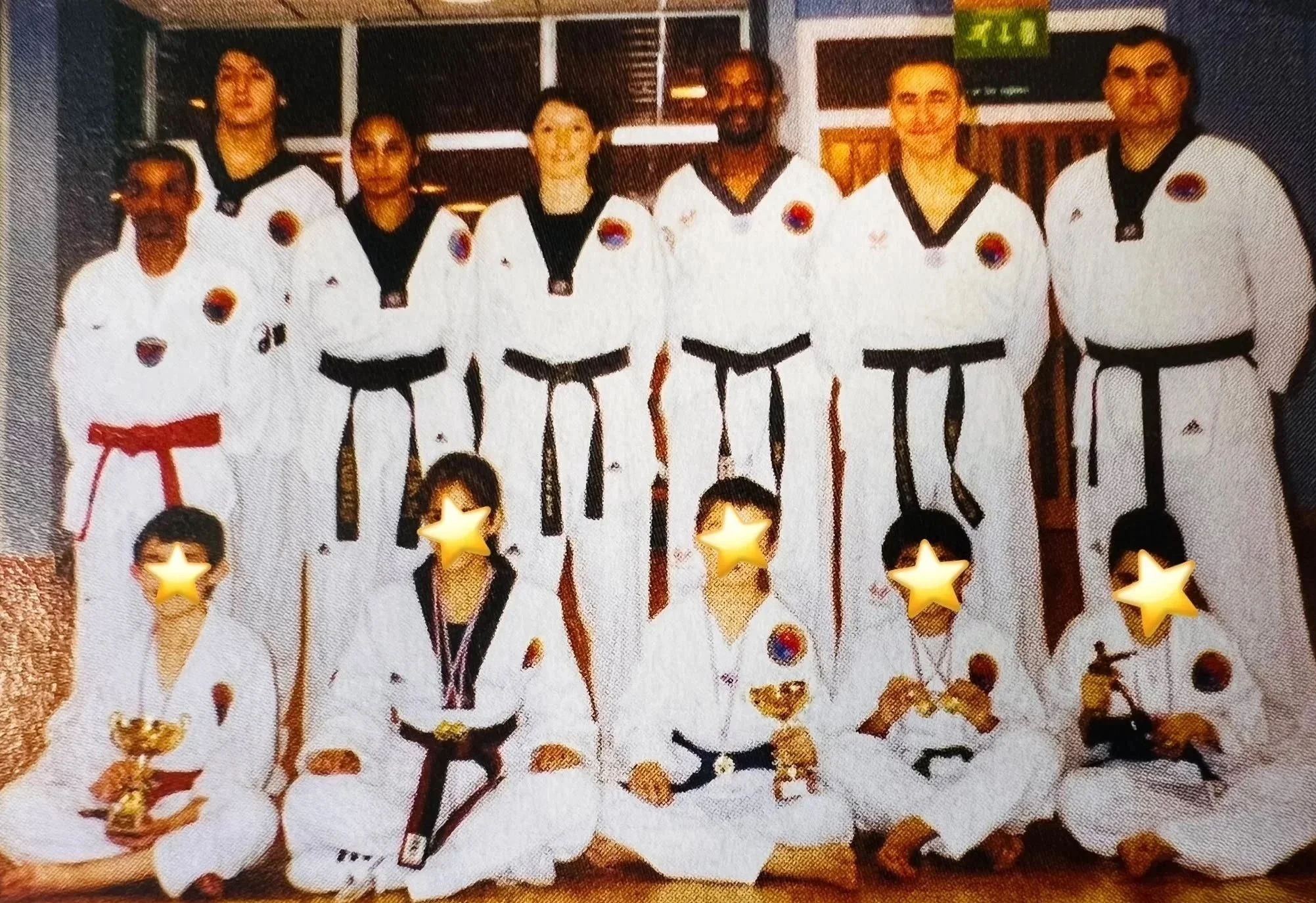 Europa Taekwondo's Coaching Team. Star Students receive medals for competing in Tournament. Also from Master Tessa for training consistently; training hard; dedicating their time and for upholding the values of Taekwondo at Europa. March 2004. 
