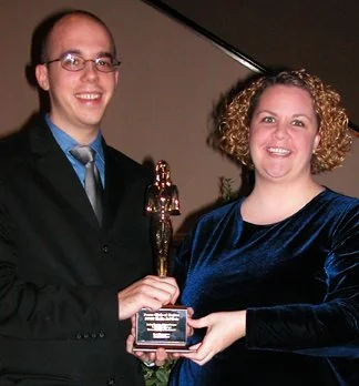 Adam Fortner (art director) and Judey Dozeto (associate publisher) accepting the Katie Award for Best Magazine, 2002 Dallas Press Club Katie Awards.