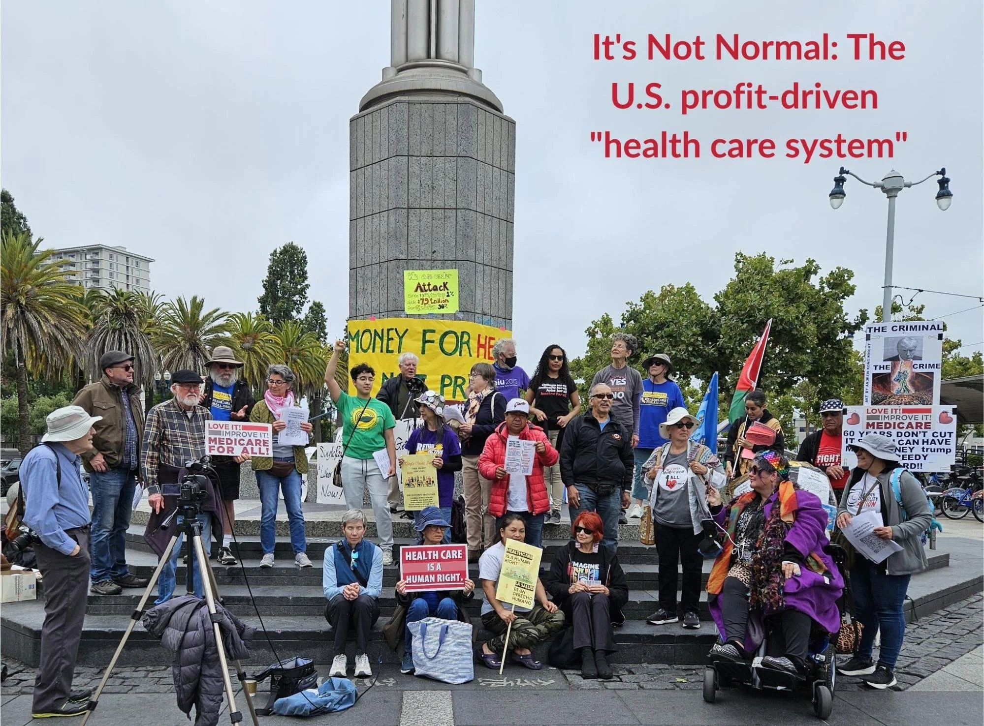 A large group of people standing and sitting outside holding signs about protecting Medicare