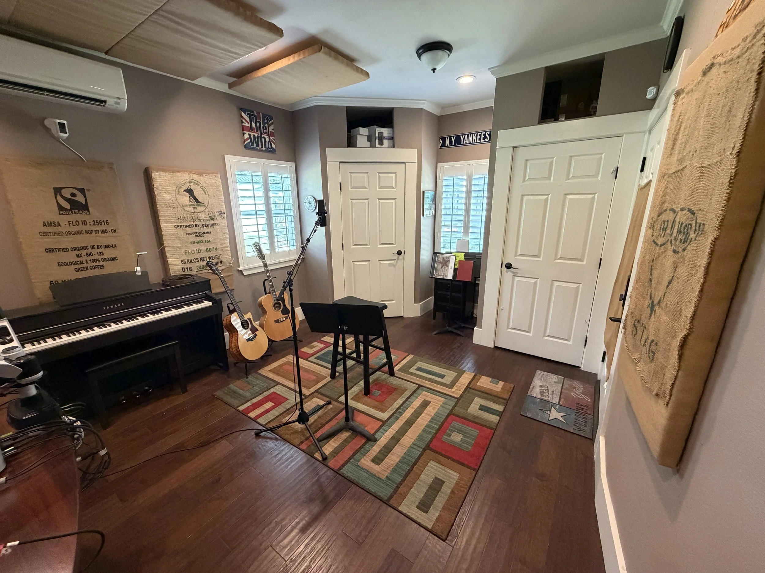 Recording space at Studio 2.0 in Seguin, Texas with piano, guitars, and vocal microphone
