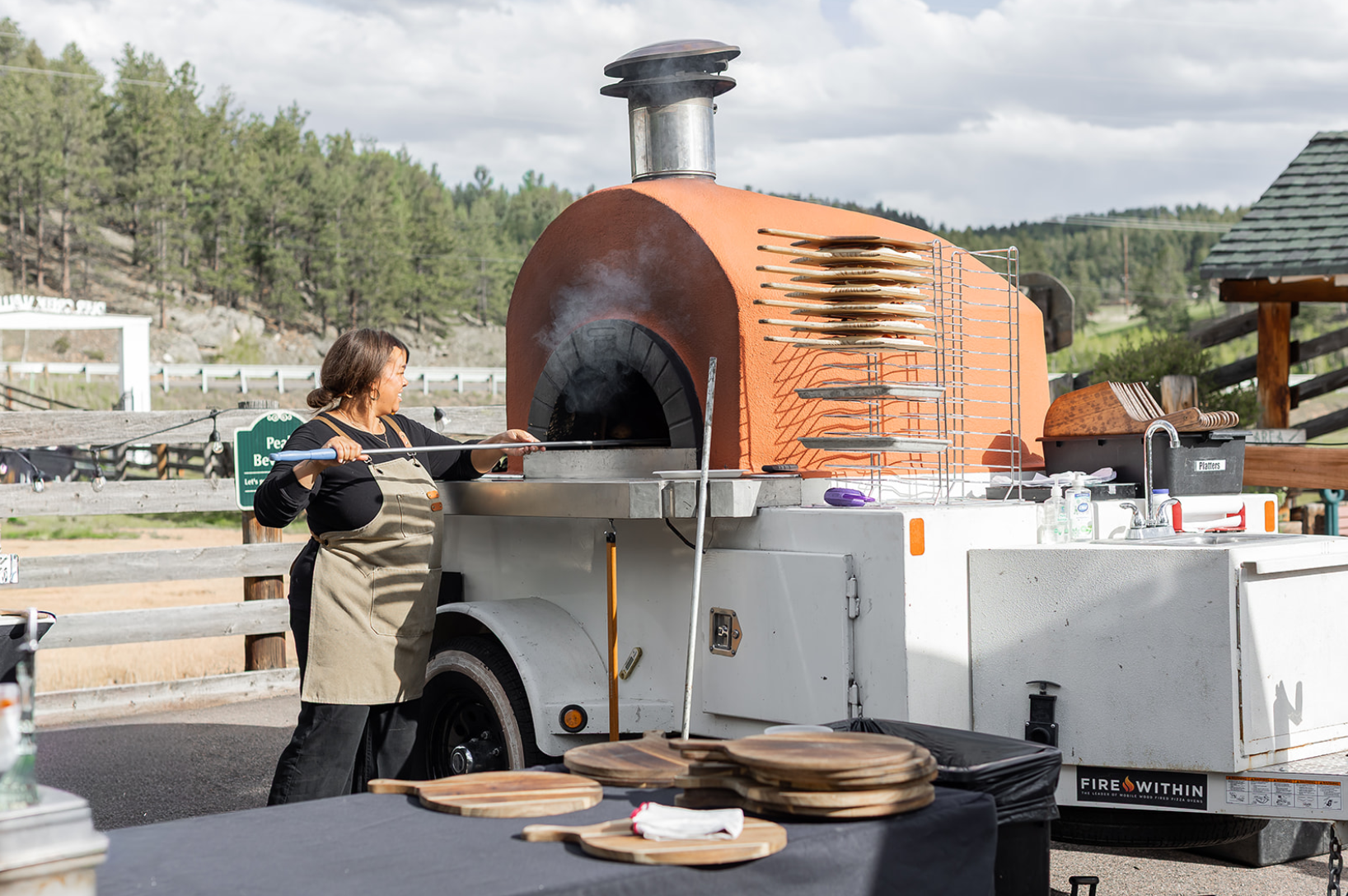 Owners of Wildfire Cuisine Co. wood-fired catering at a Colorado wedding