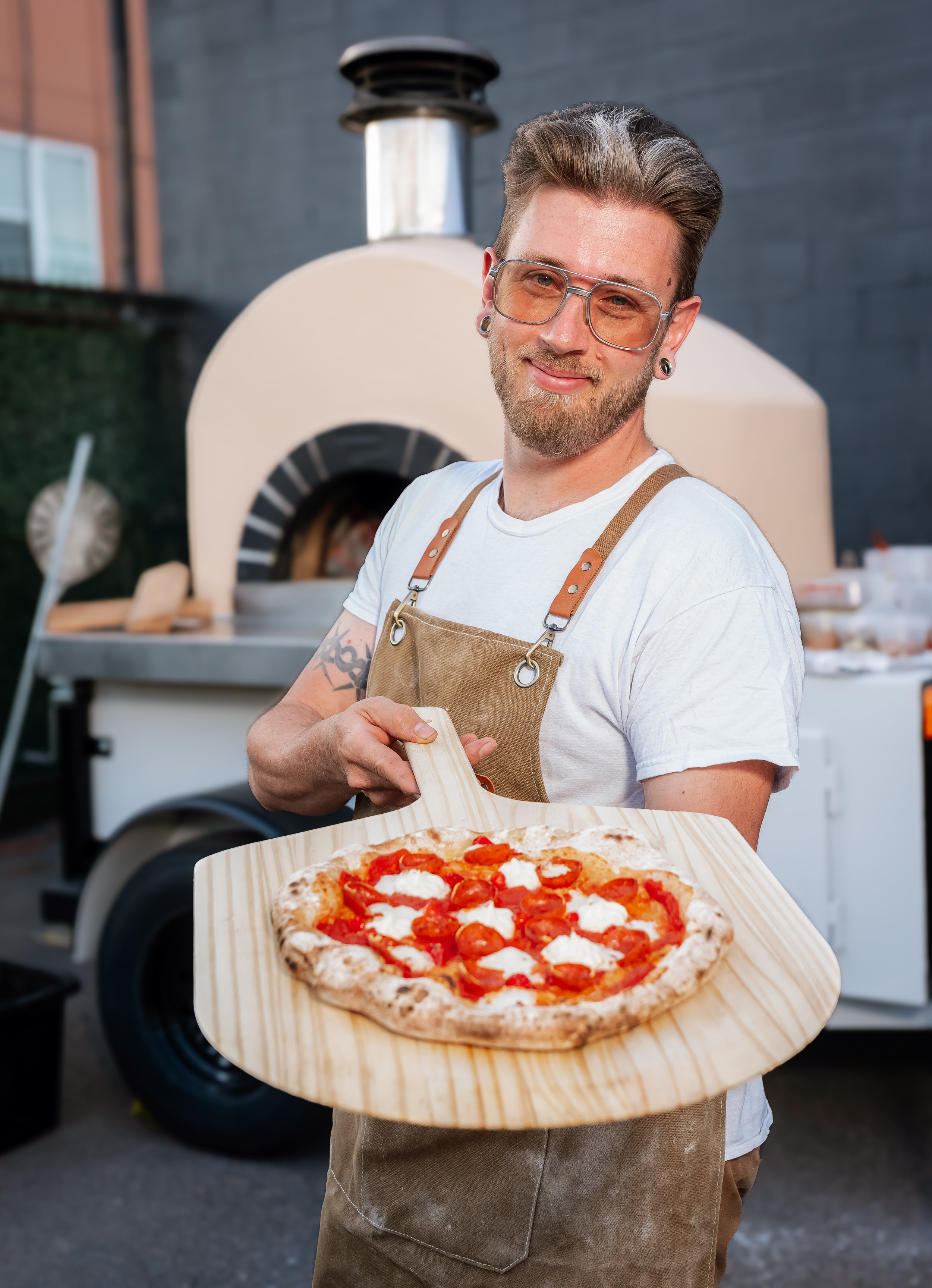 Owners of Wildfire Cuisine Co. wood-fired catering at a Colorado wedding