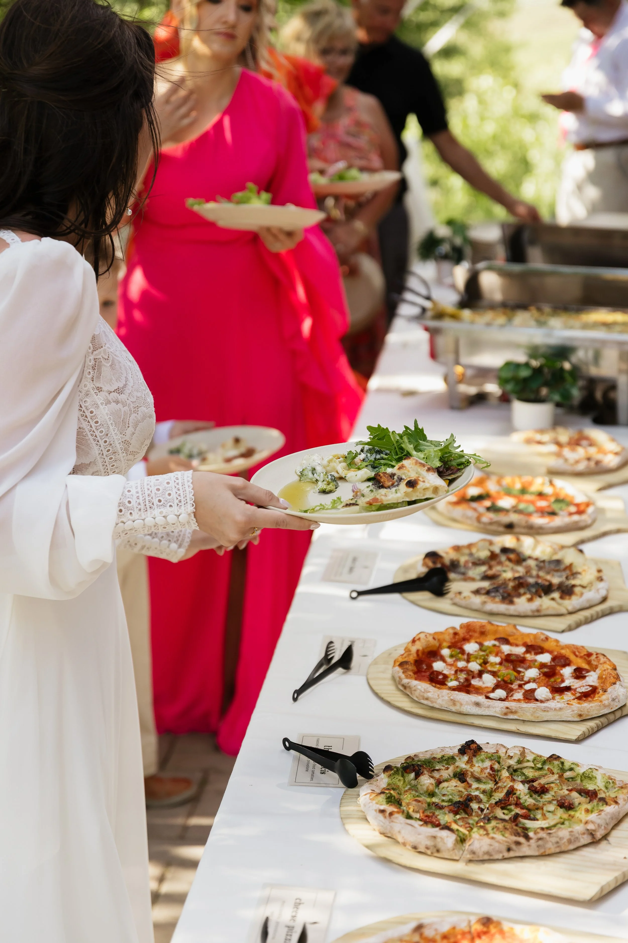 Guests enjoying Wildfire Cuisine Co. wood-fired catering at a Colorado wedding