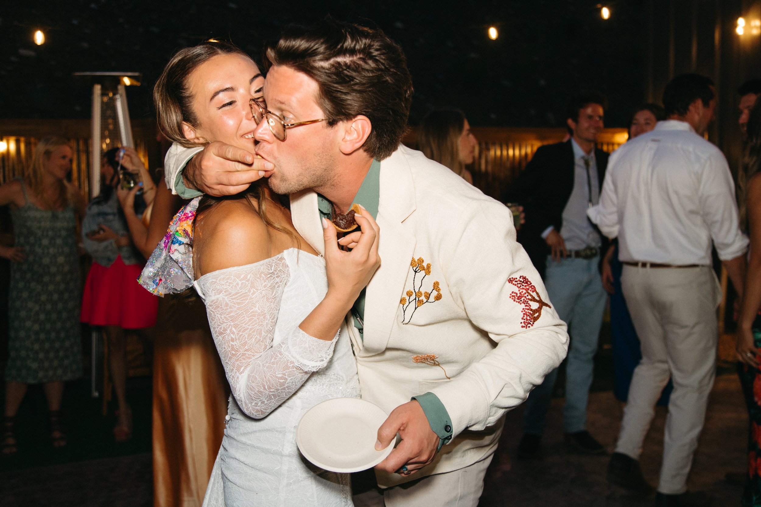 Guests enjoying Wildfire Cuisine Co. wood-fired catering at a Colorado wedding