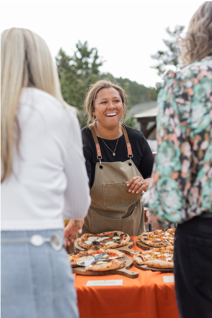 Owners of Wildfire Cuisine Co. wood-fired catering at a Colorado wedding