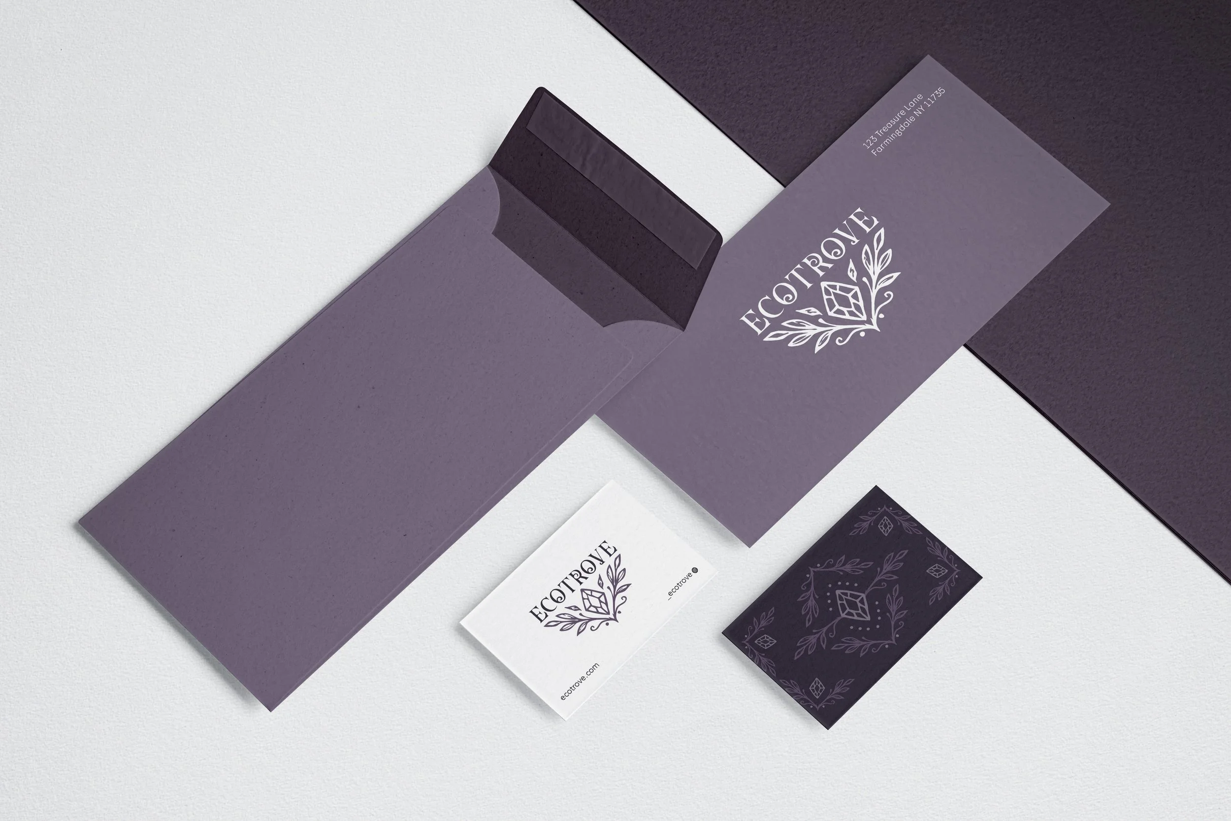 Ecotrove thrifting subscription box stationary with purple envelopes and business cards
