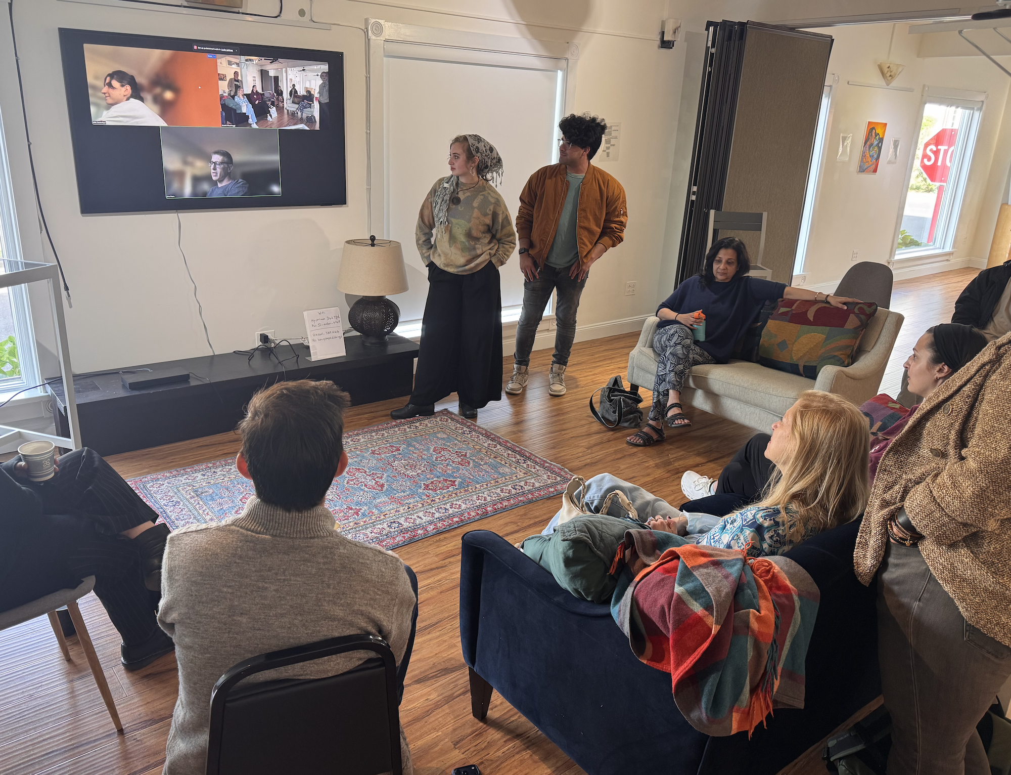 The Curators of Open Archways presenting during an artist meeting.