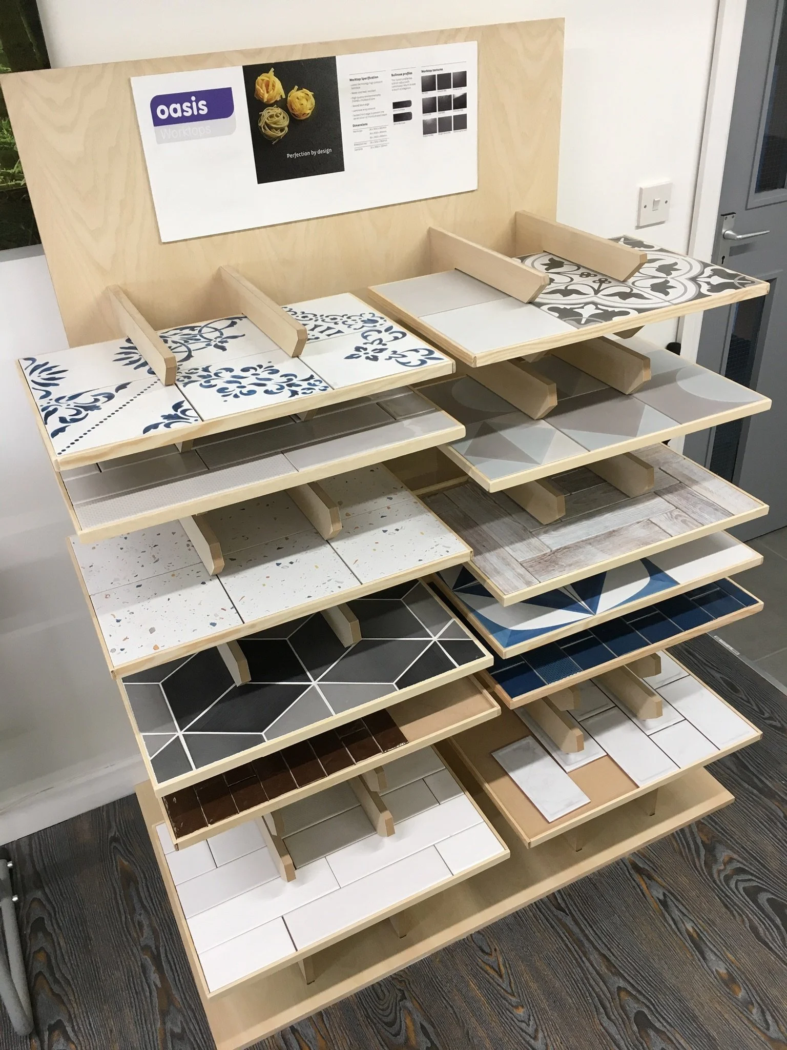 Display rack with various tile samples in different colors and patterns.