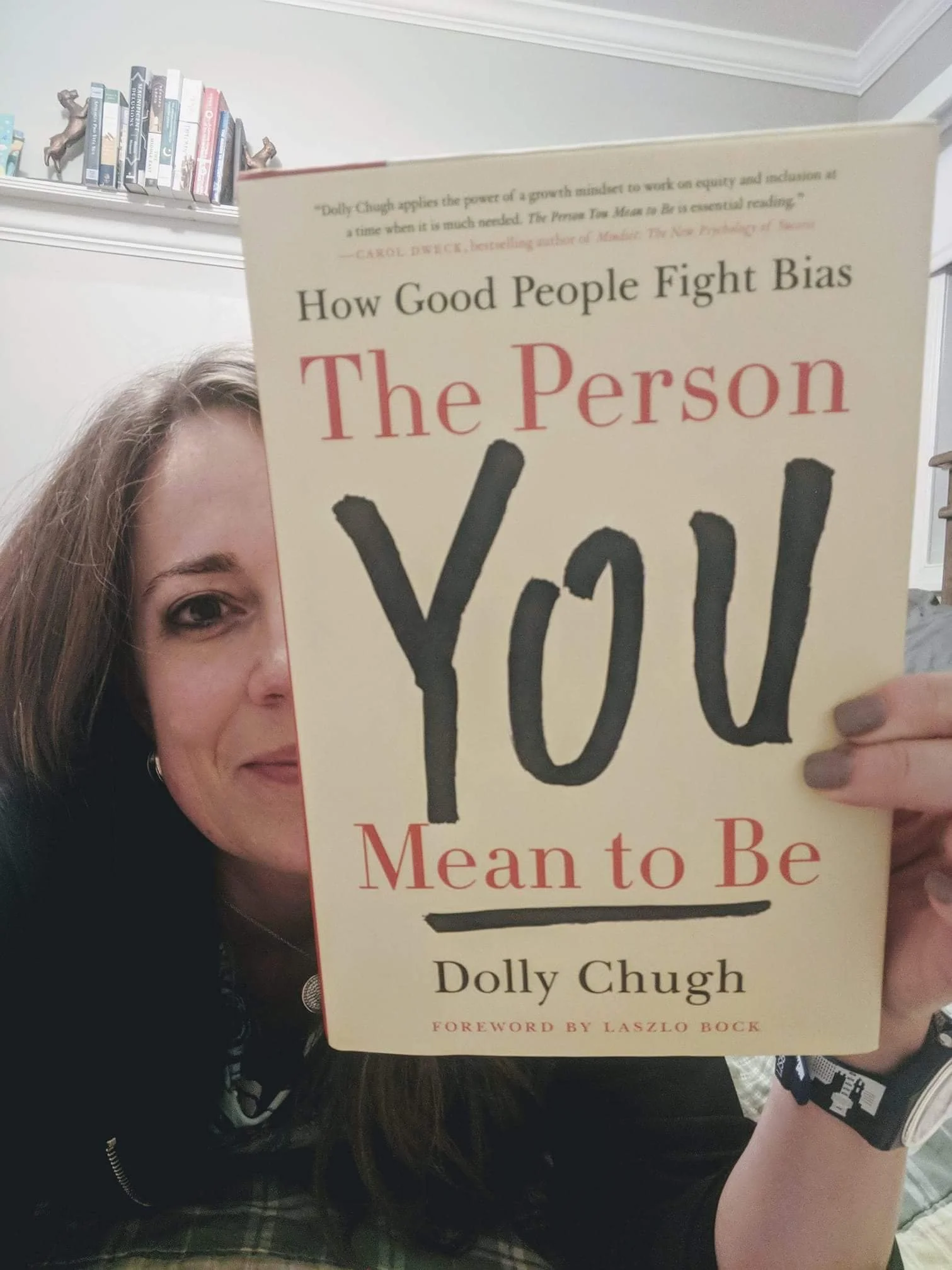 Woman holding The Person You Mean to Be book