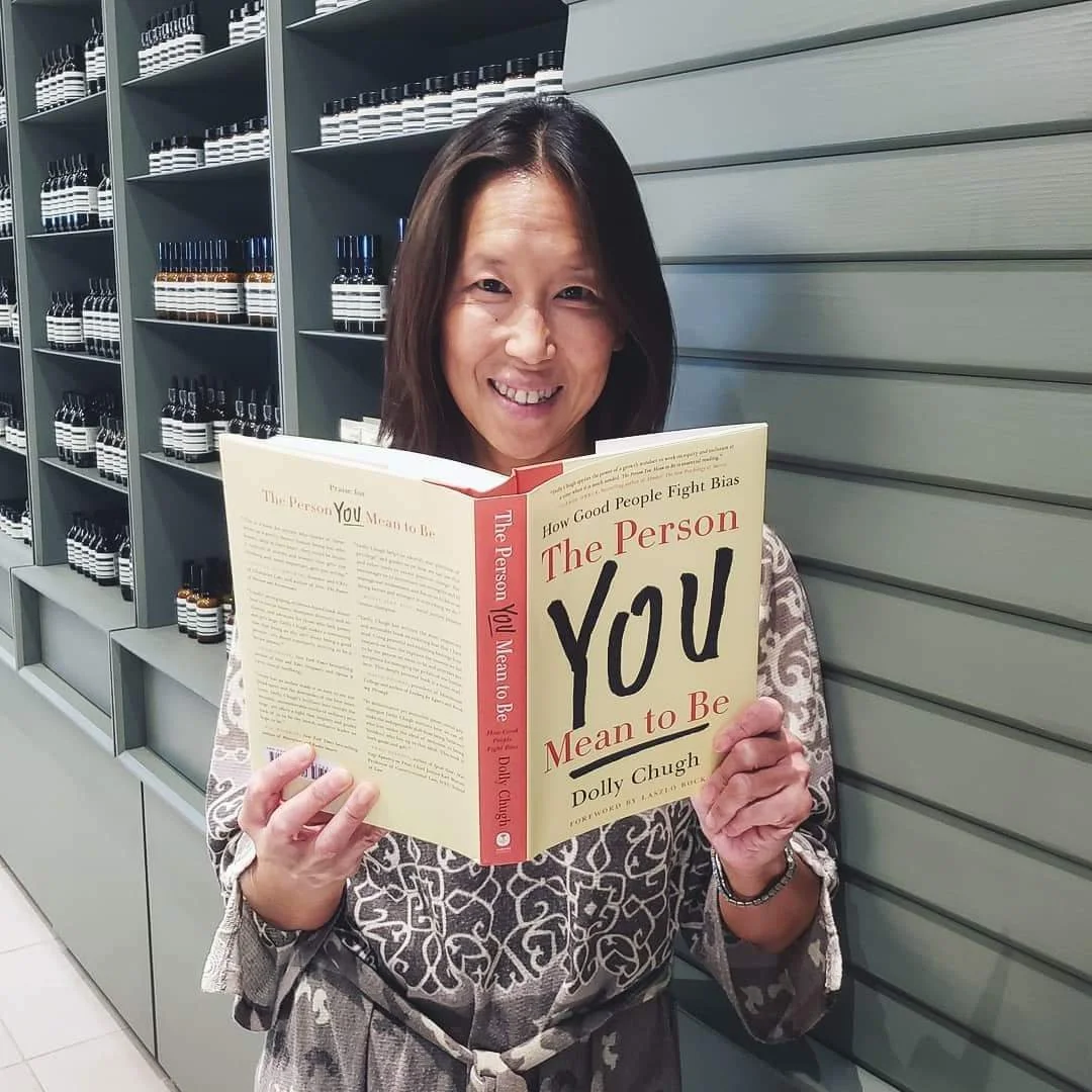 Woman holding The Person You Mean to Be book