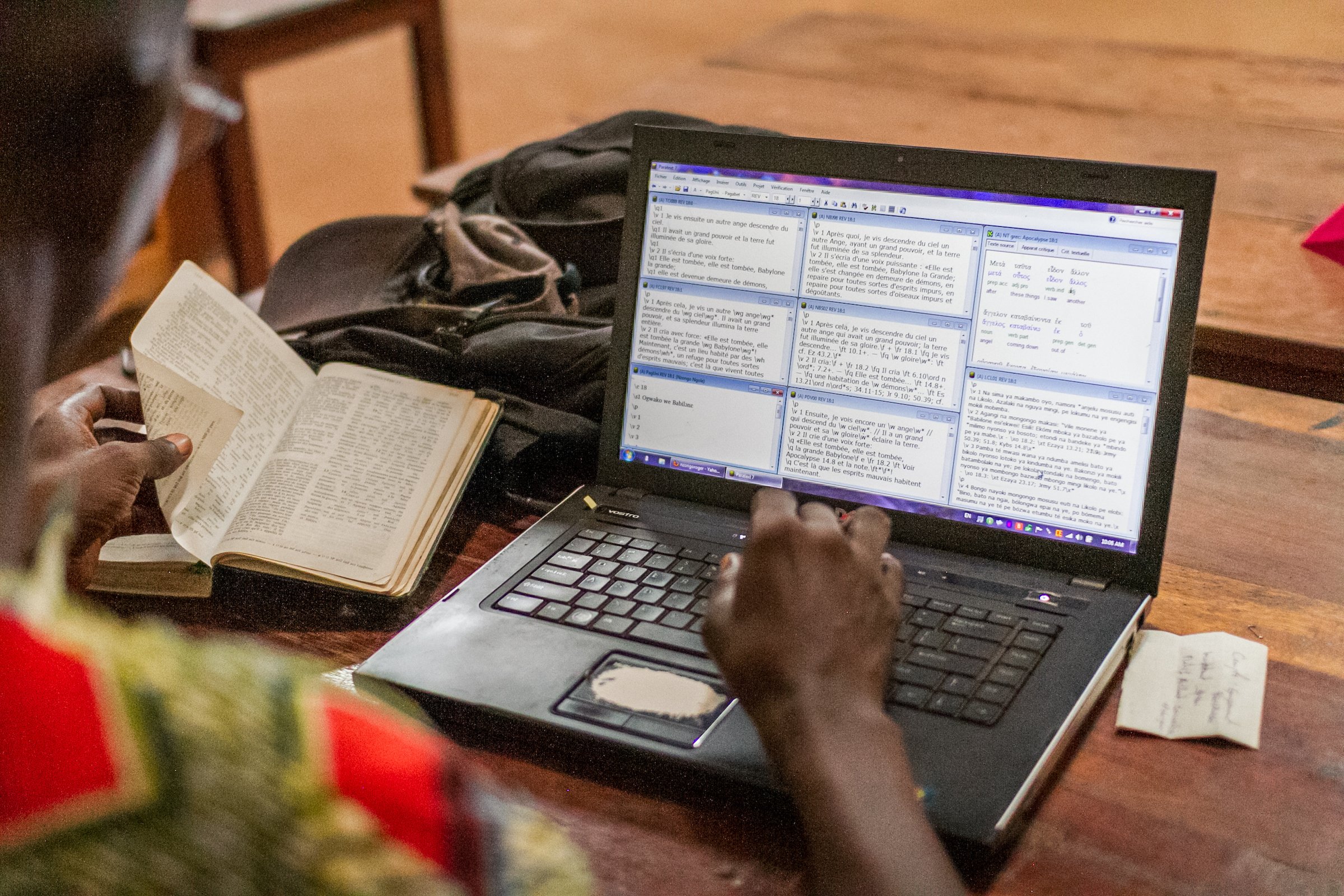 Roger Nzongo Ngole works on translating Revelations 18:1. He is using a program called Paratext to assist him in translation.