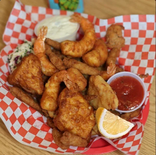 Around here, when life gives you lemons, we squeeze them on our amazing Combo Platter. 

Golden deep fried halibut, cod, prawns, scallops and clam strips along with hot seasoned crispy fries, along with a squeeze of fresh lemon that tells you it's go