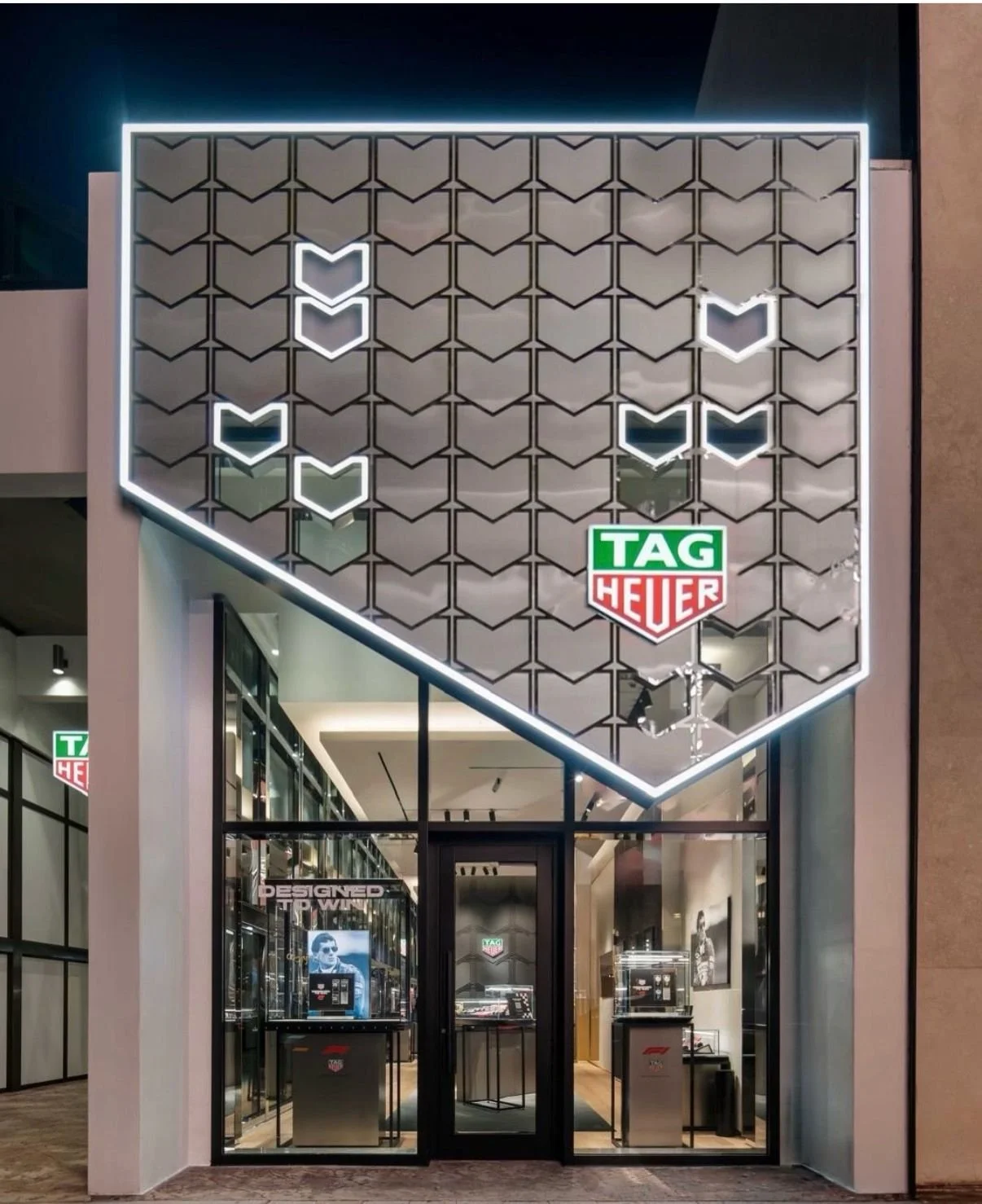 Luxury watchmaker boutique storefront and illuminated entrance managed by Charrette Management Group (CMG)
