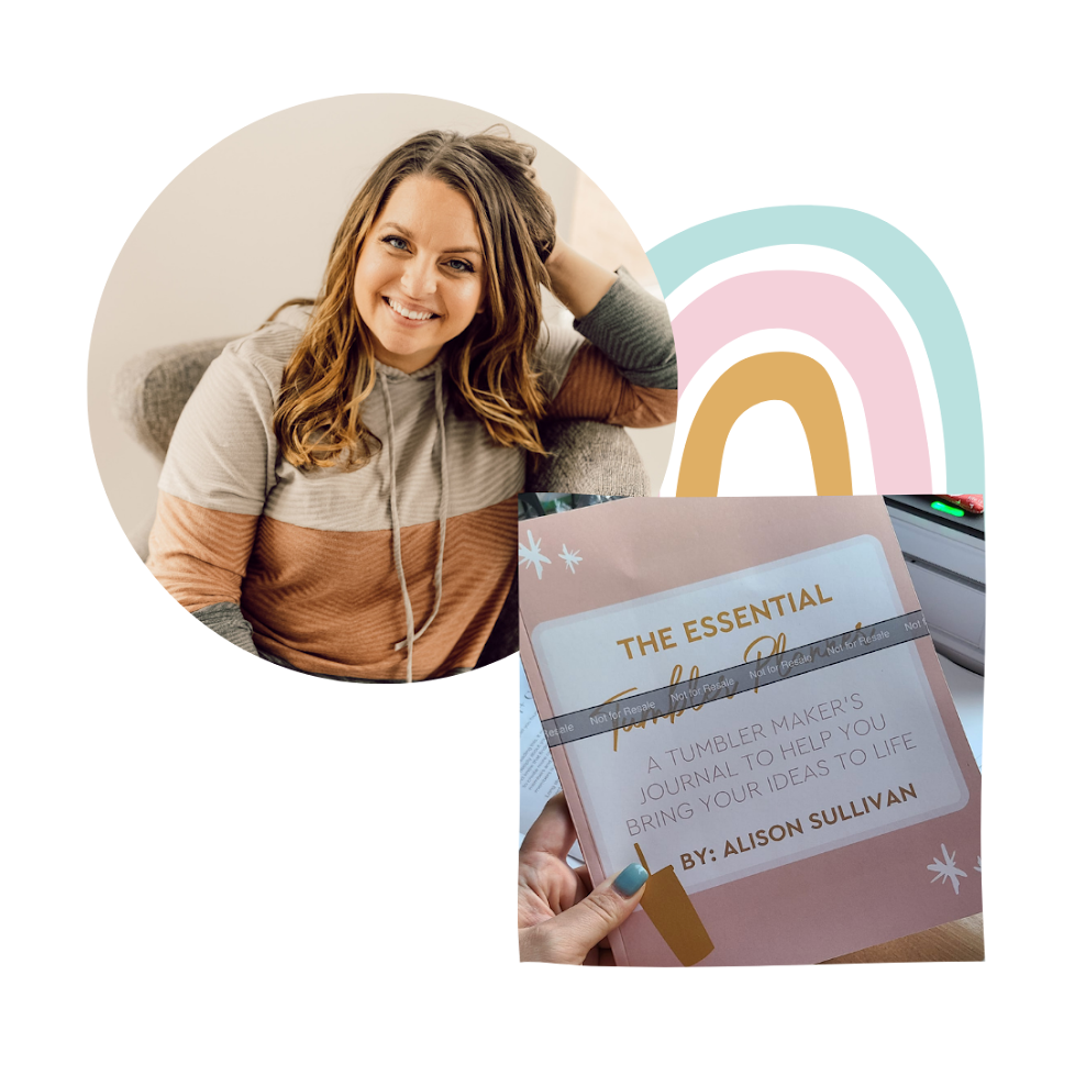 A smiling woman with wavy brown hair wearing a multicolored hoodie, sitting on a couch in a cozy setting. In the foreground, a hand holds a book titled 'The Essential Tumbler Maker's Journal' by Alison Sullivan.