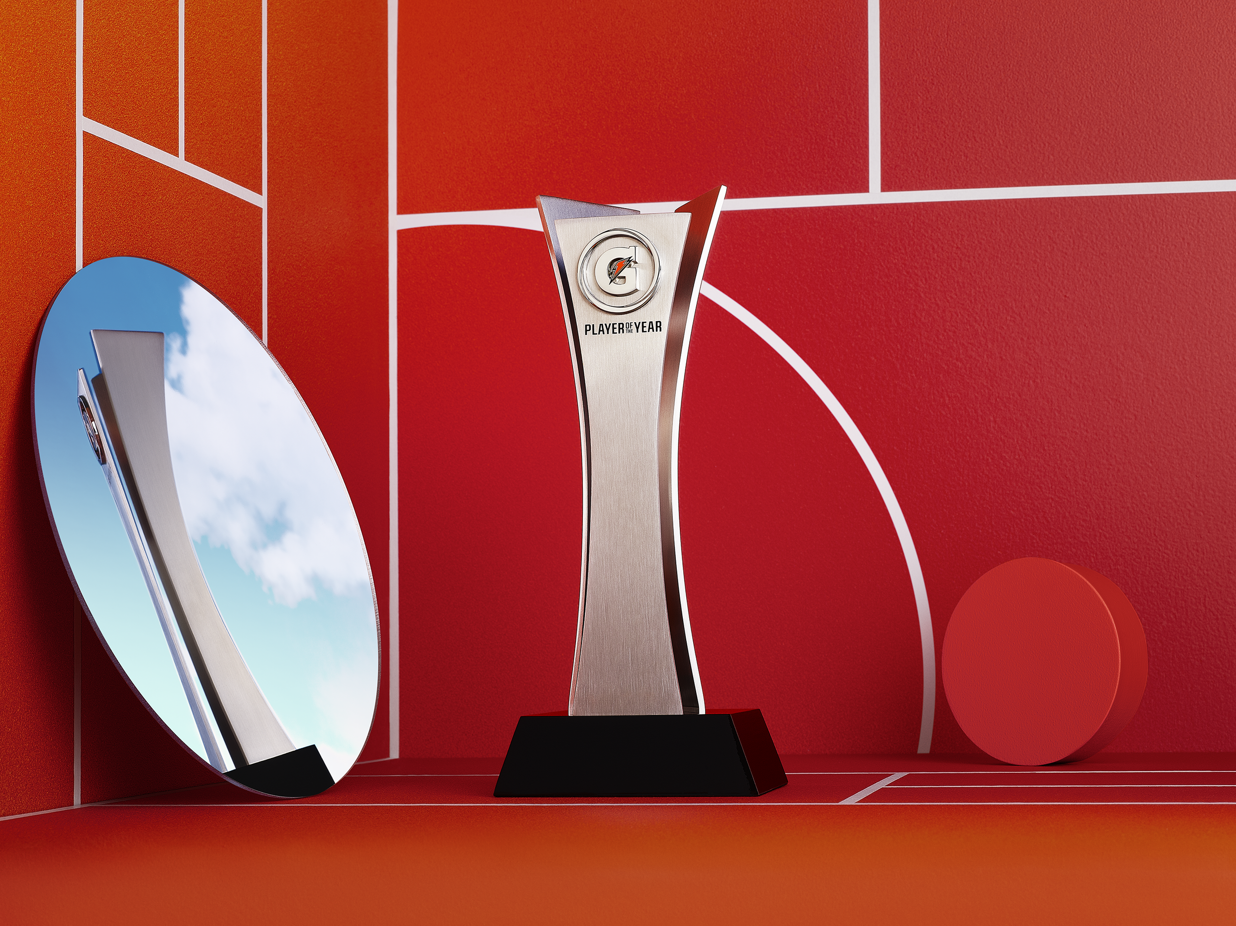 A trophy with the Gatorade logo and the words "Player of the Year" on it, placed on a black stand, against a red background with white lines and circular shapes.
