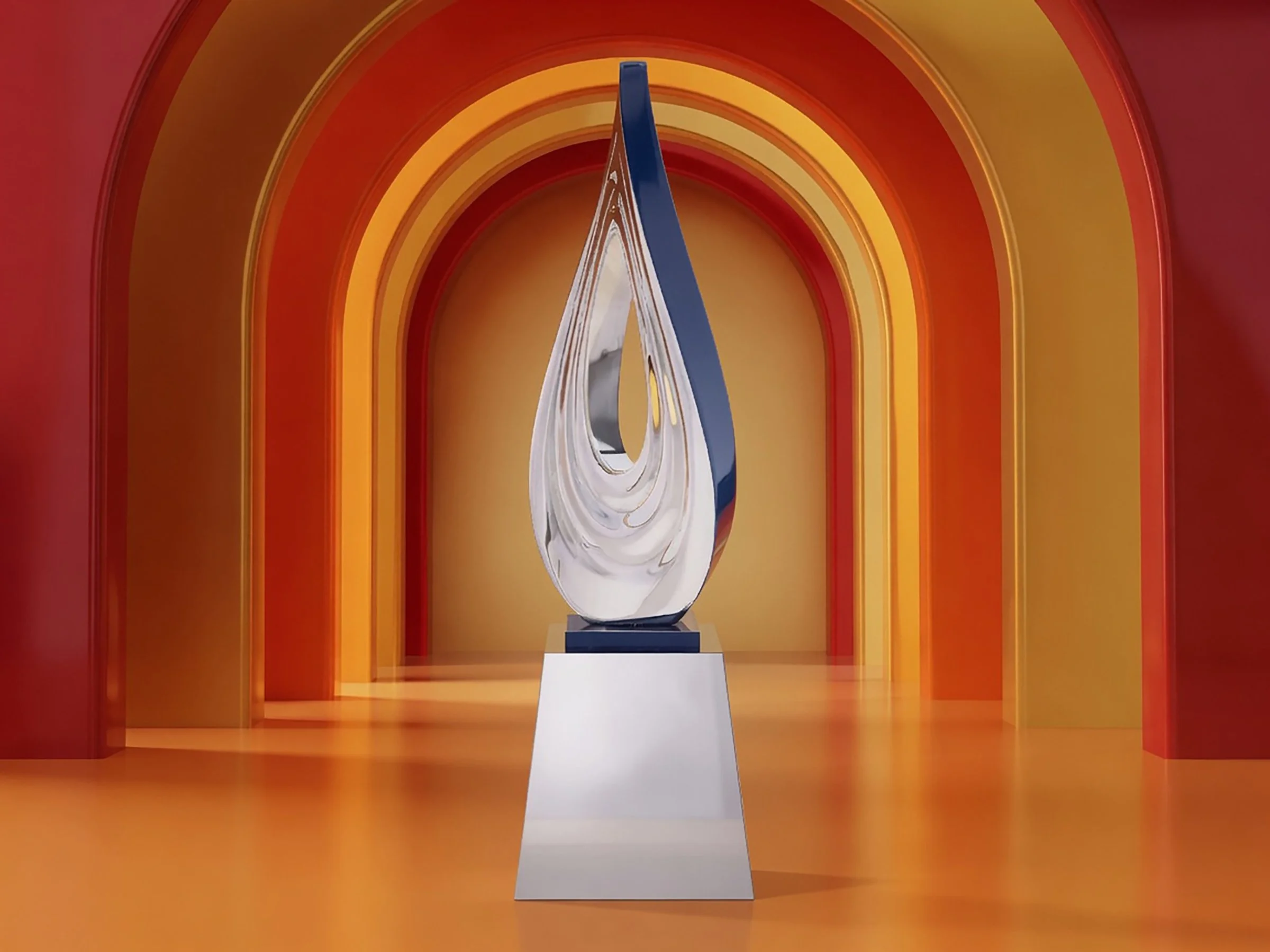 Modern abstract corporate award sculpture displayed in a gallery with vibrant orange and yellow arches.