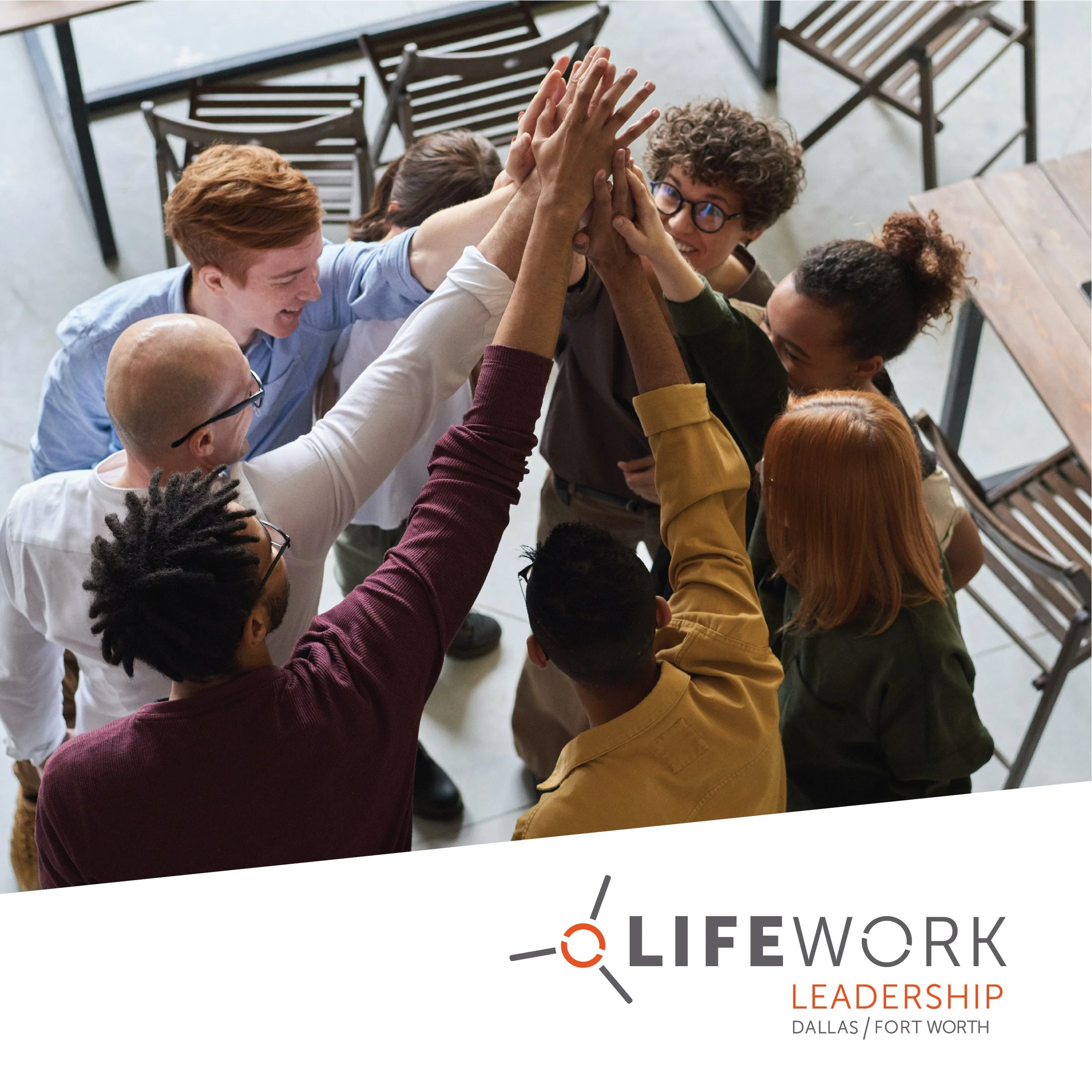 Group of diverse young adults engaging in a team high-five, smiling and celebrating in an indoor workspace with chairs in the background. The bottom right corner features the text "Lifework Leadership Dallas/Fort Worth."