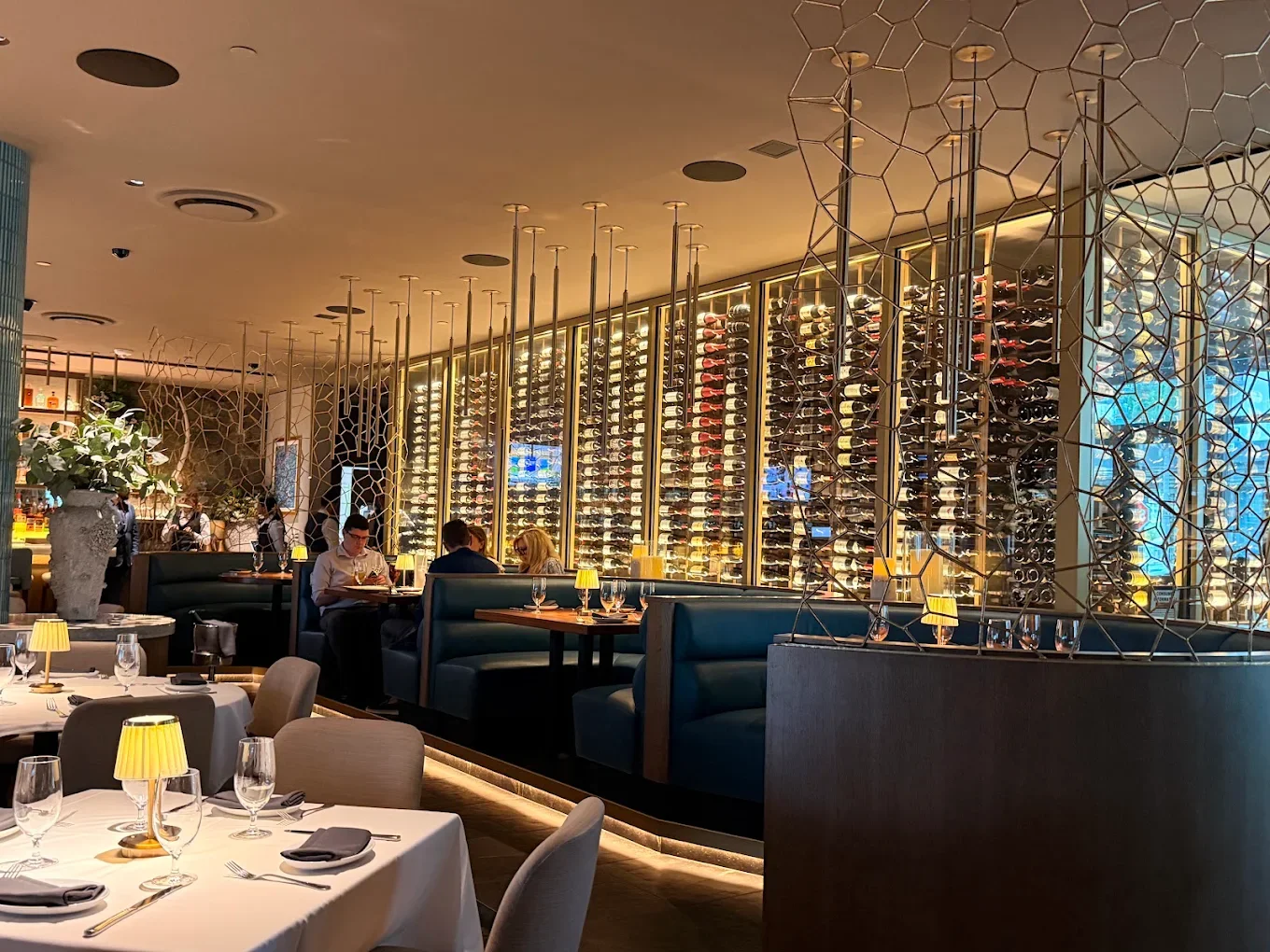 Elegant restaurant interior at Ocean Prime Restaurant Sarasota featuring luxury finishes, custom lighting, and upscale commercial design.